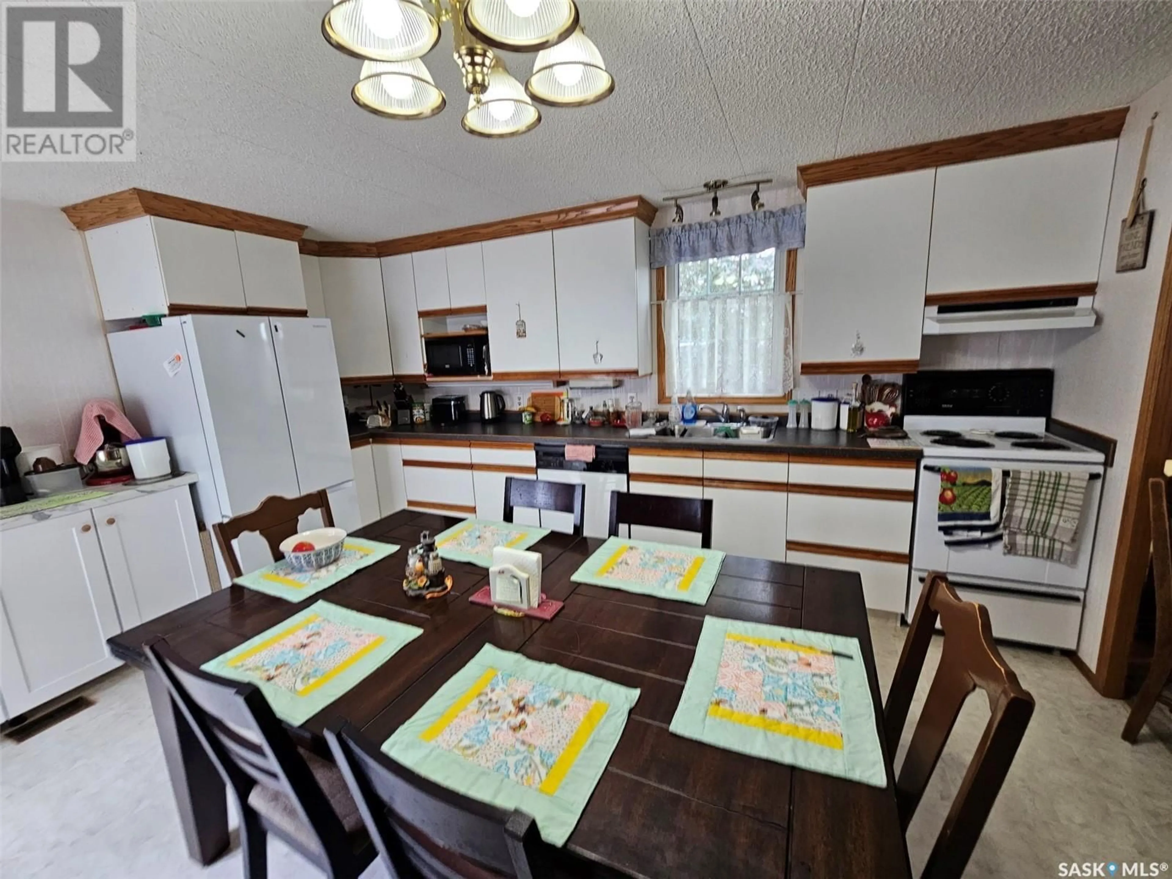 Open concept kitchen, ceramic/tile floor for 323 6TH STREET, Carlyle Saskatchewan S0C0R0
