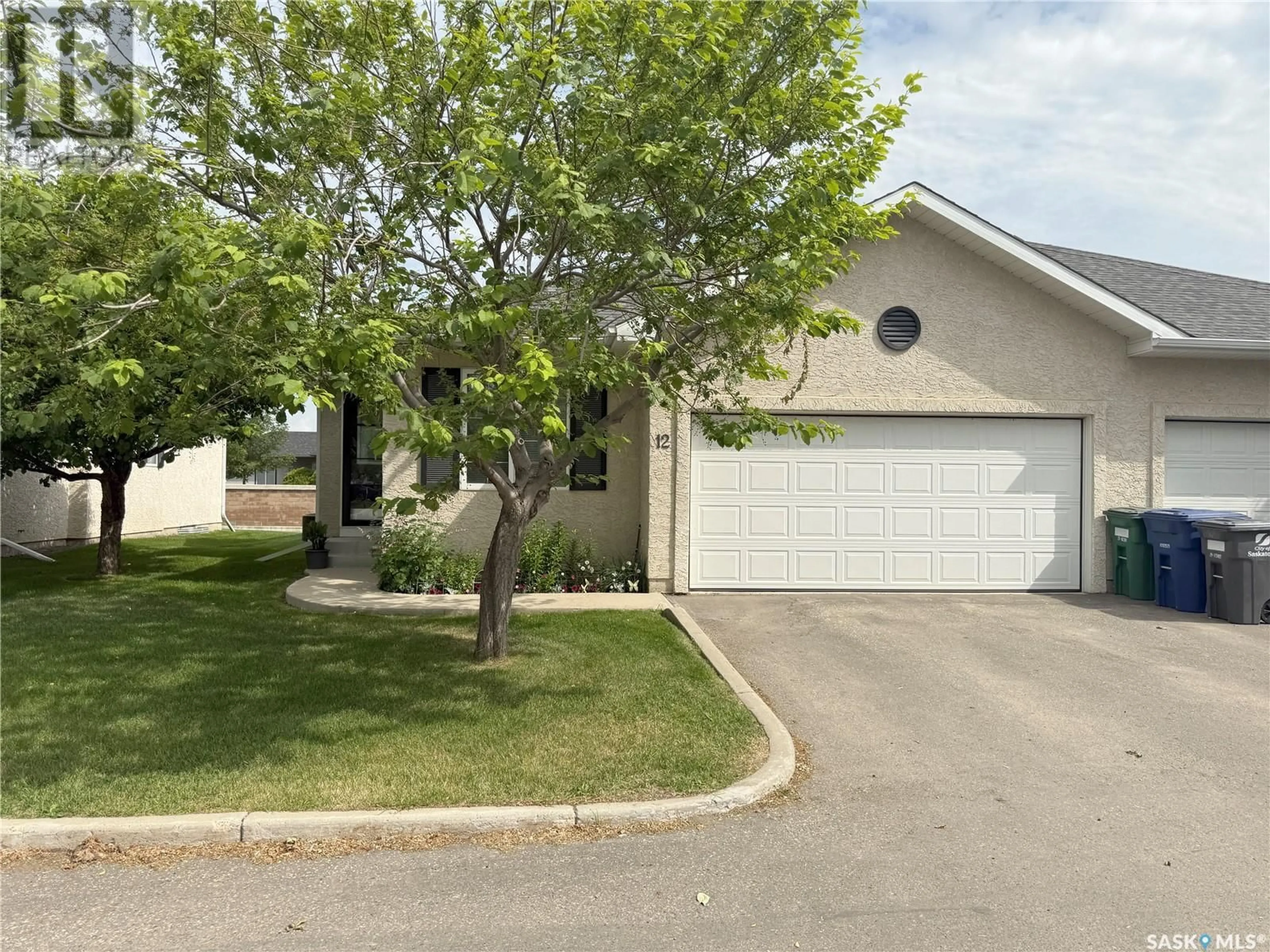 Home with vinyl exterior material, street for 12 110 BANYAN CRESCENT, Saskatoon Saskatchewan S7V1G7