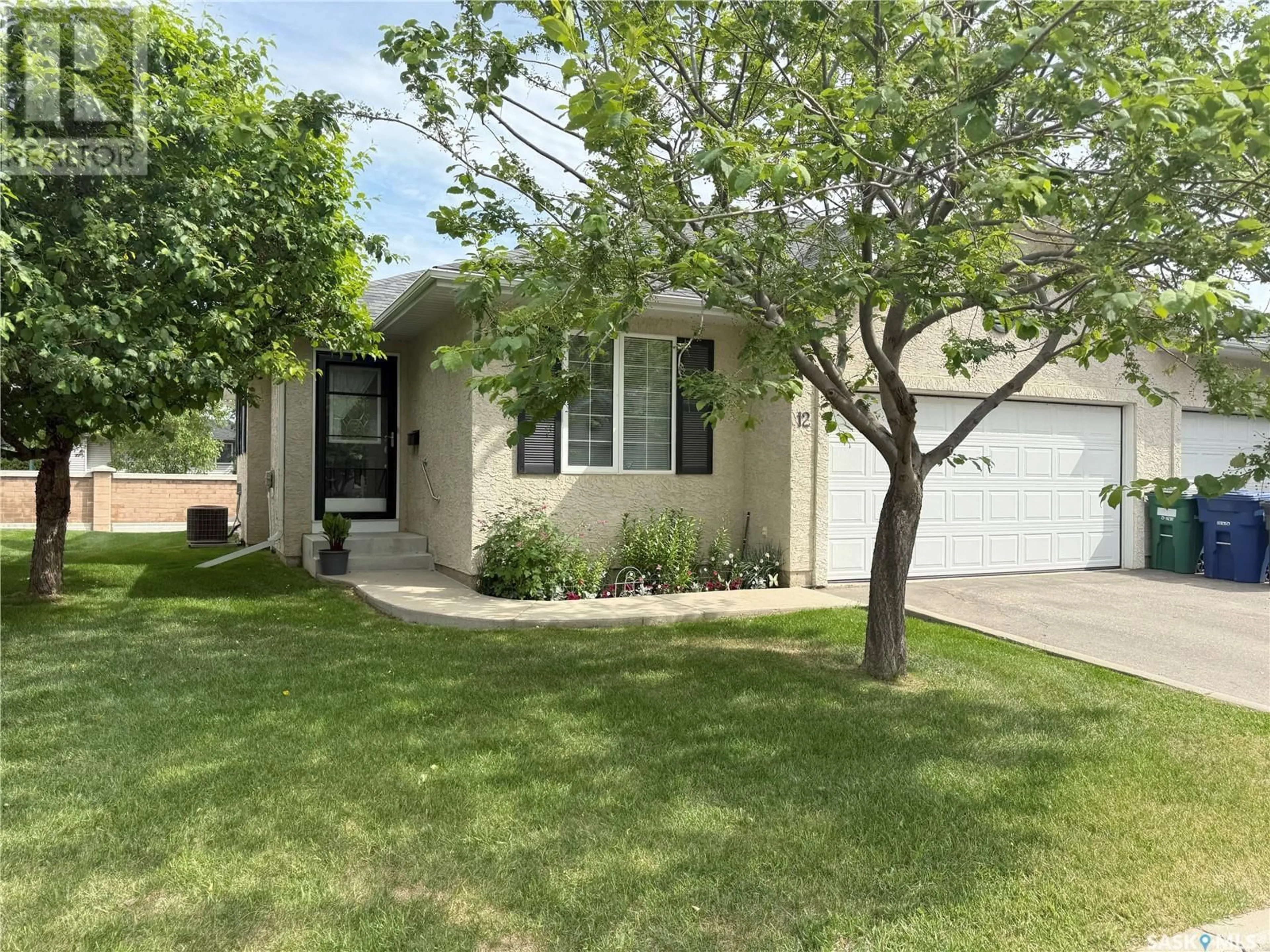 Home with vinyl exterior material, street for 12 110 BANYAN CRESCENT, Saskatoon Saskatchewan S7V1G7