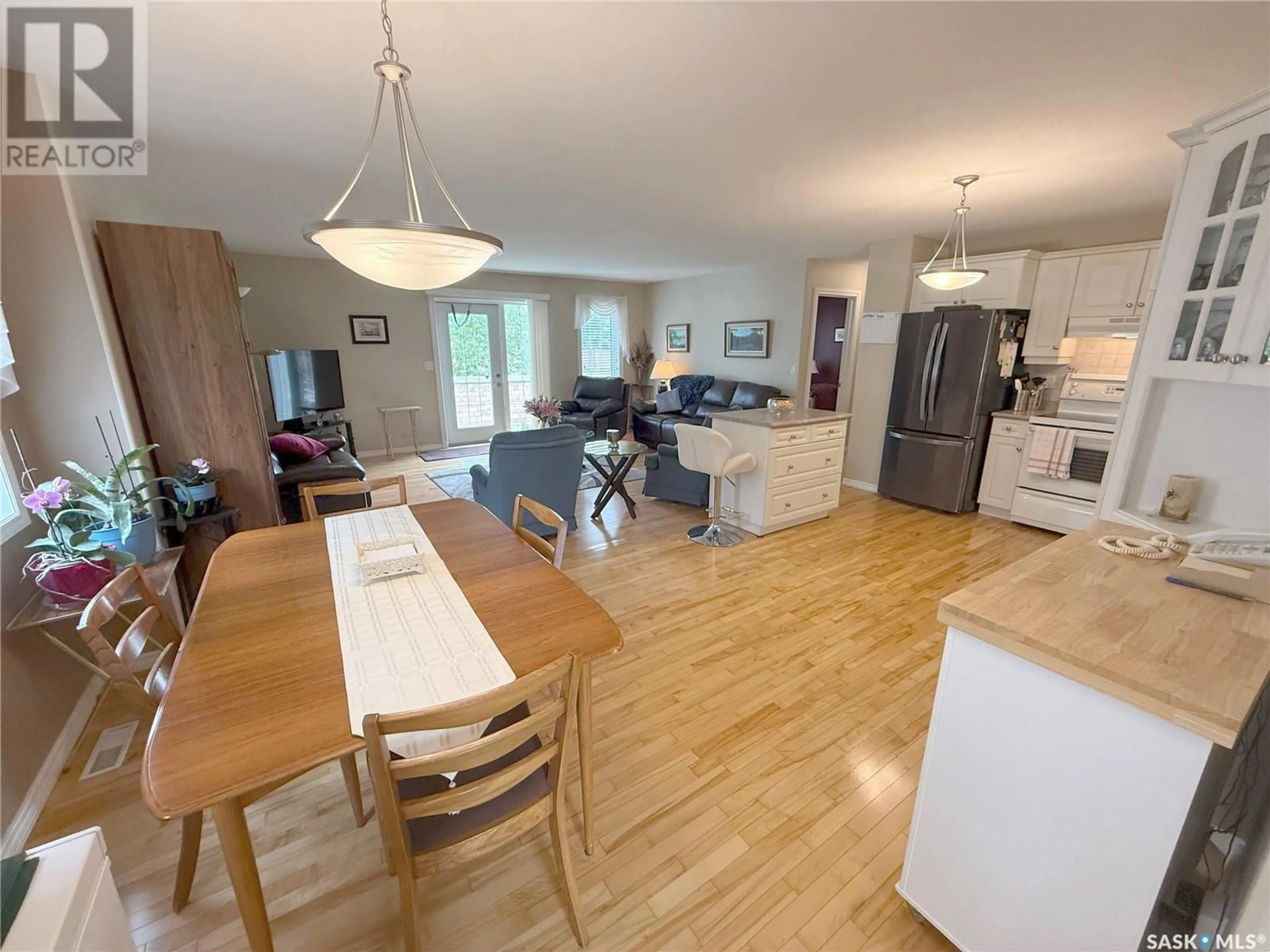 Open concept kitchen, wood/laminate floor for 12 110 BANYAN CRESCENT, Saskatoon Saskatchewan S7V1G7