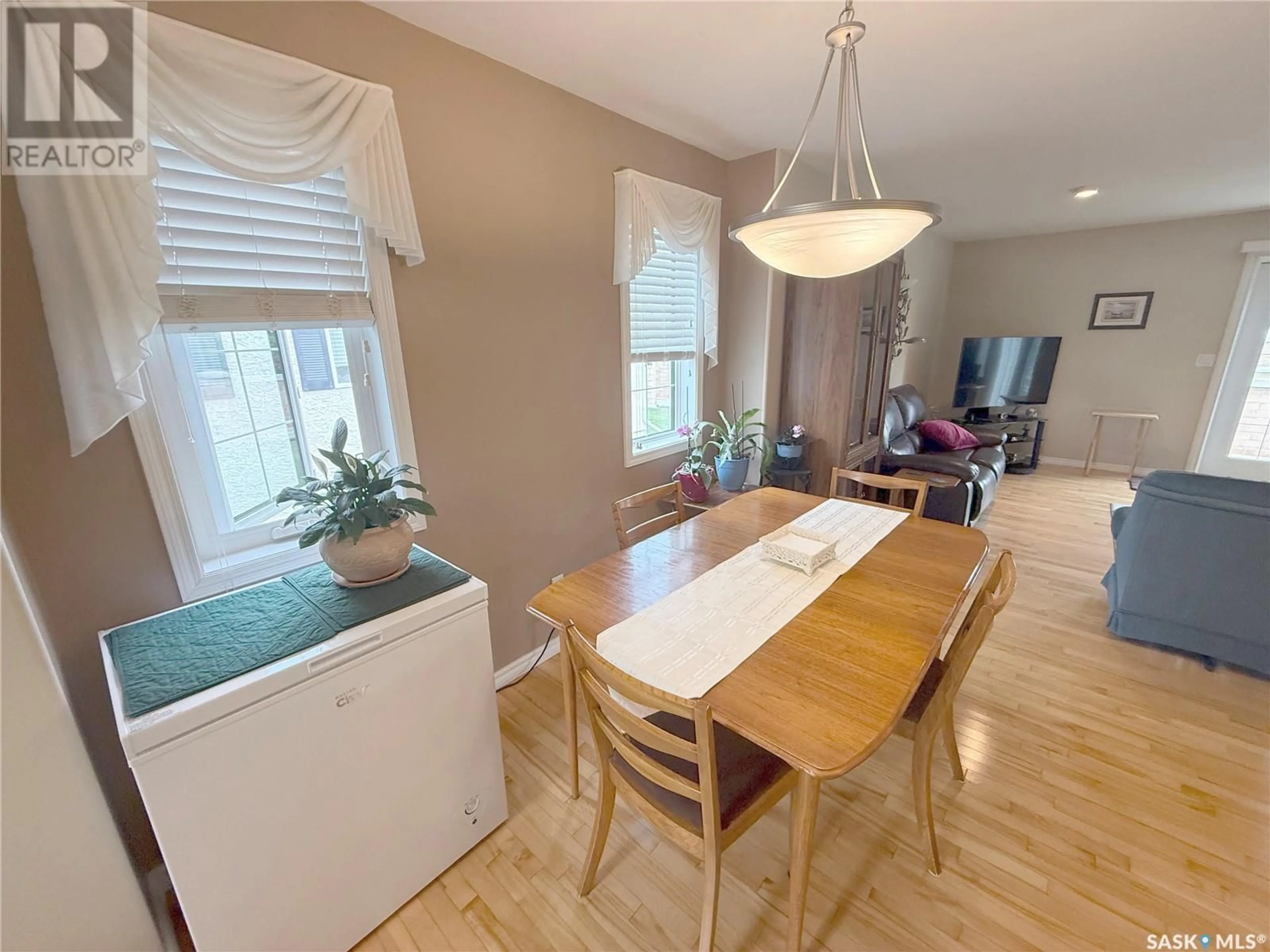 Dining room, wood/laminate floor for 12 110 BANYAN CRESCENT, Saskatoon Saskatchewan S7V1G7