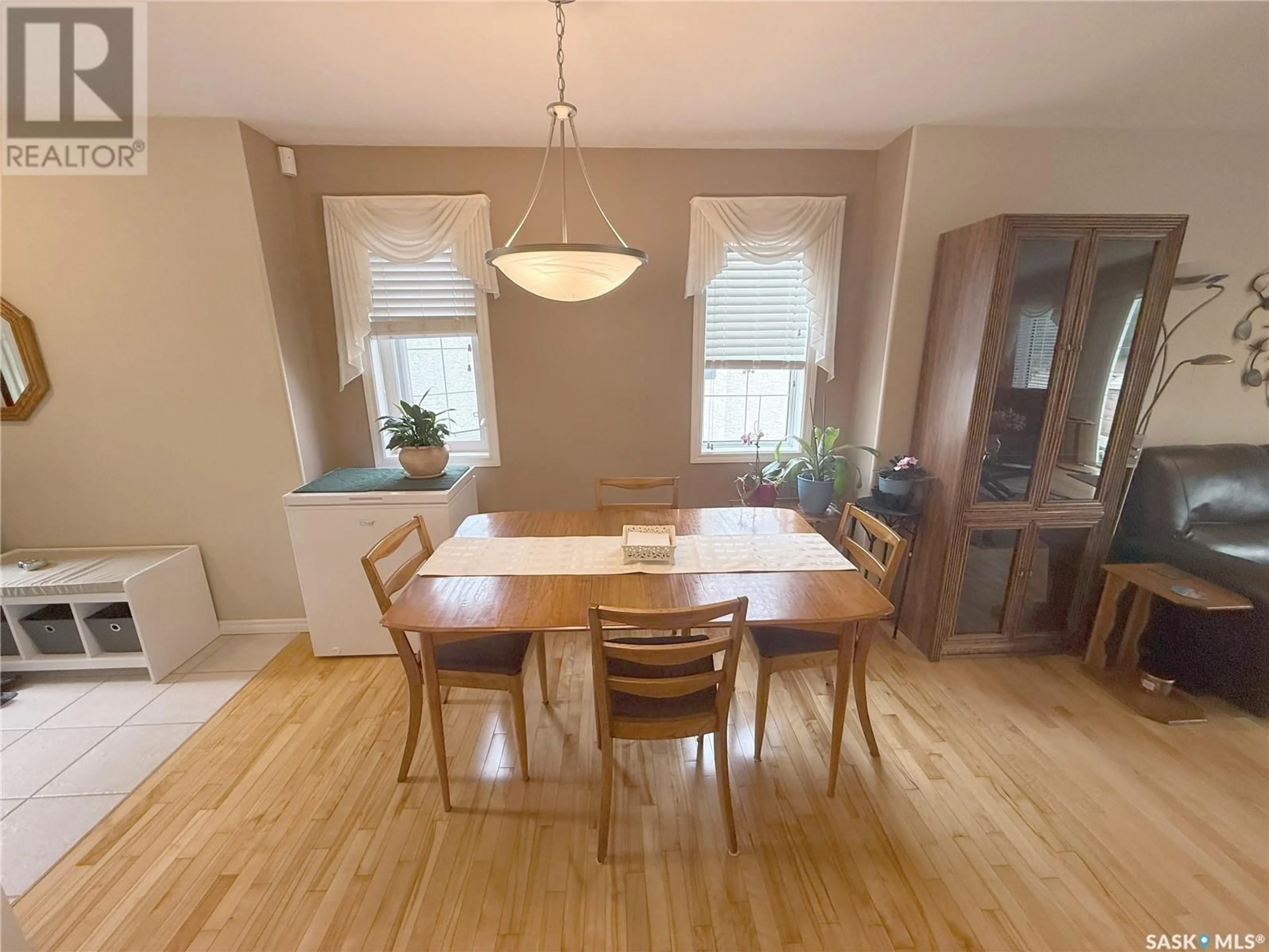 Dining room, wood/laminate floor for 12 110 BANYAN CRESCENT, Saskatoon Saskatchewan S7V1G7