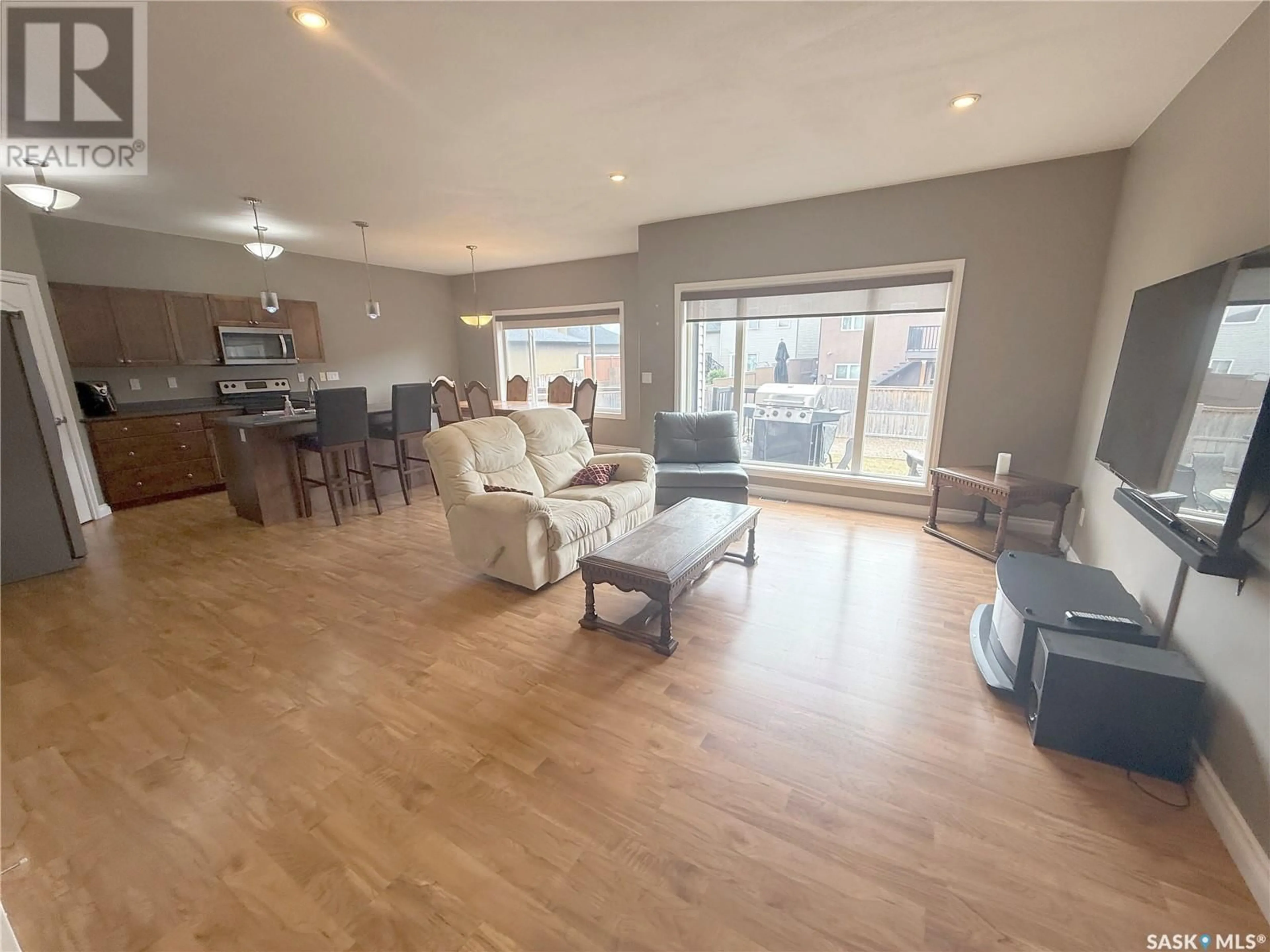 Living room with furniture, unknown for 135 WEST HAMPTON BOULEVARD, Saskatoon Saskatchewan S7R0B7