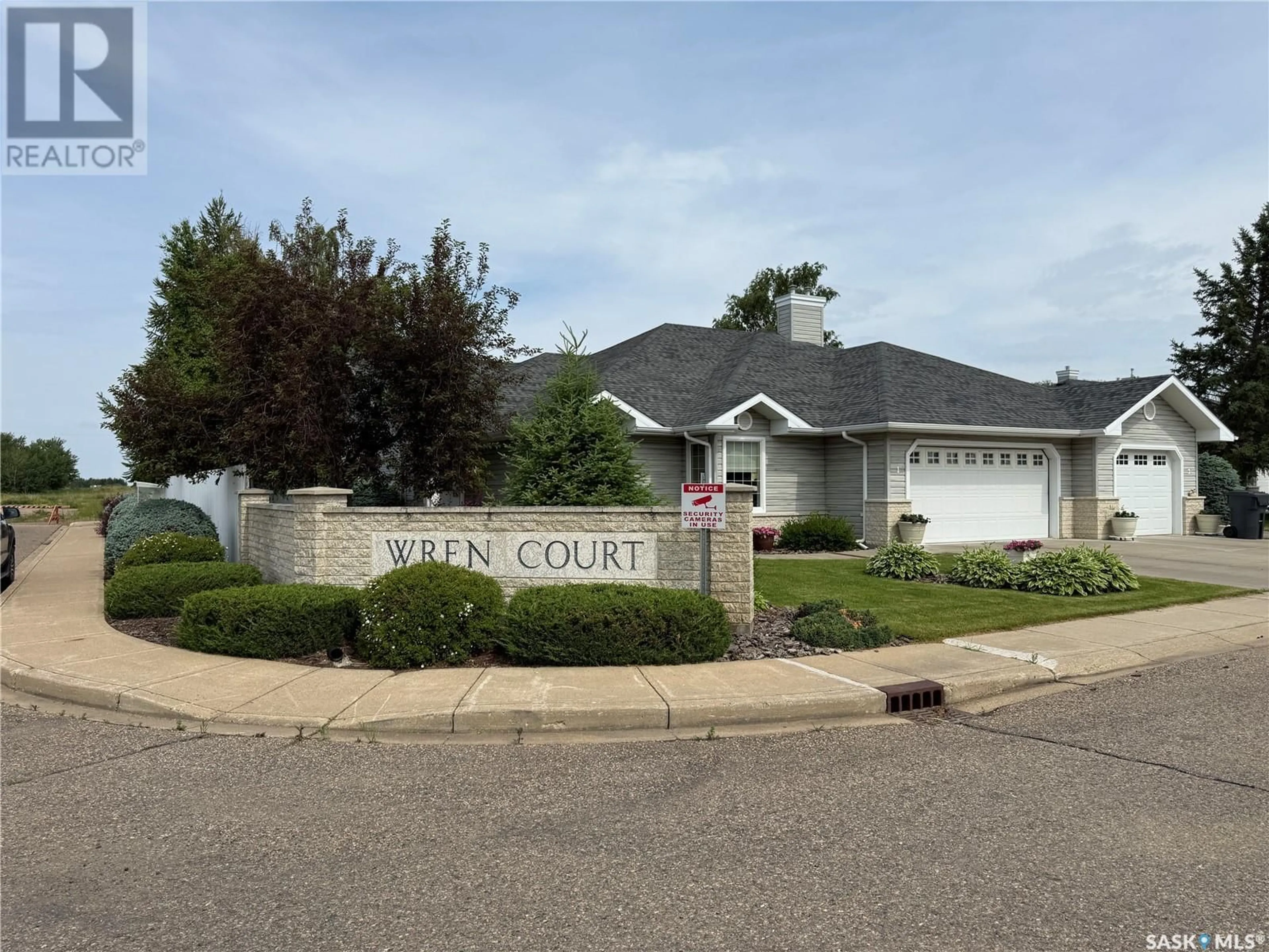 Home with vinyl exterior material, street for 1 - 2502 KILLDEER DRIVE, North Battleford Saskatchewan S9A3Z2