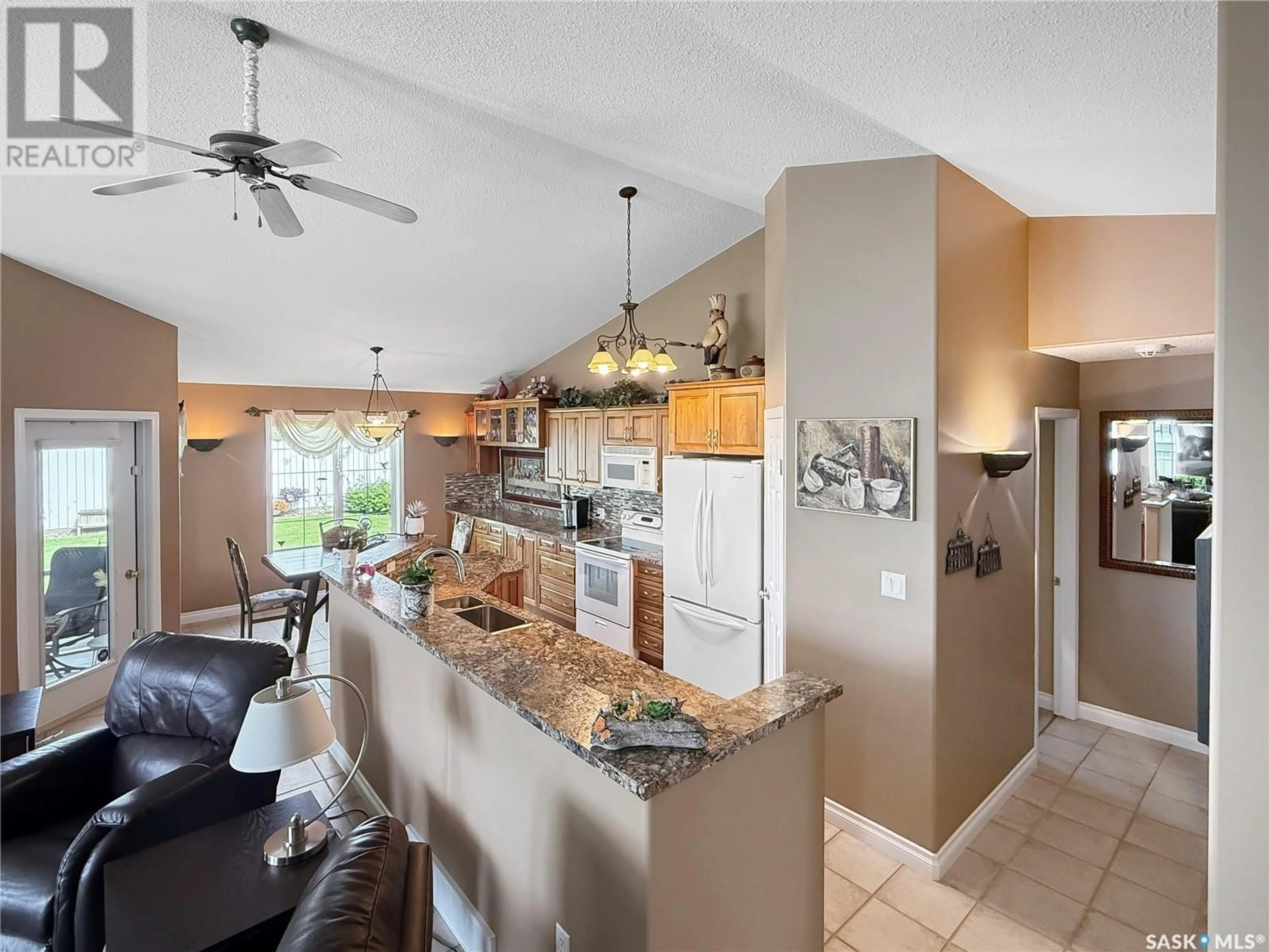 Open concept kitchen, ceramic/tile floor for 1 - 2502 KILLDEER DRIVE, North Battleford Saskatchewan S9A3Z2