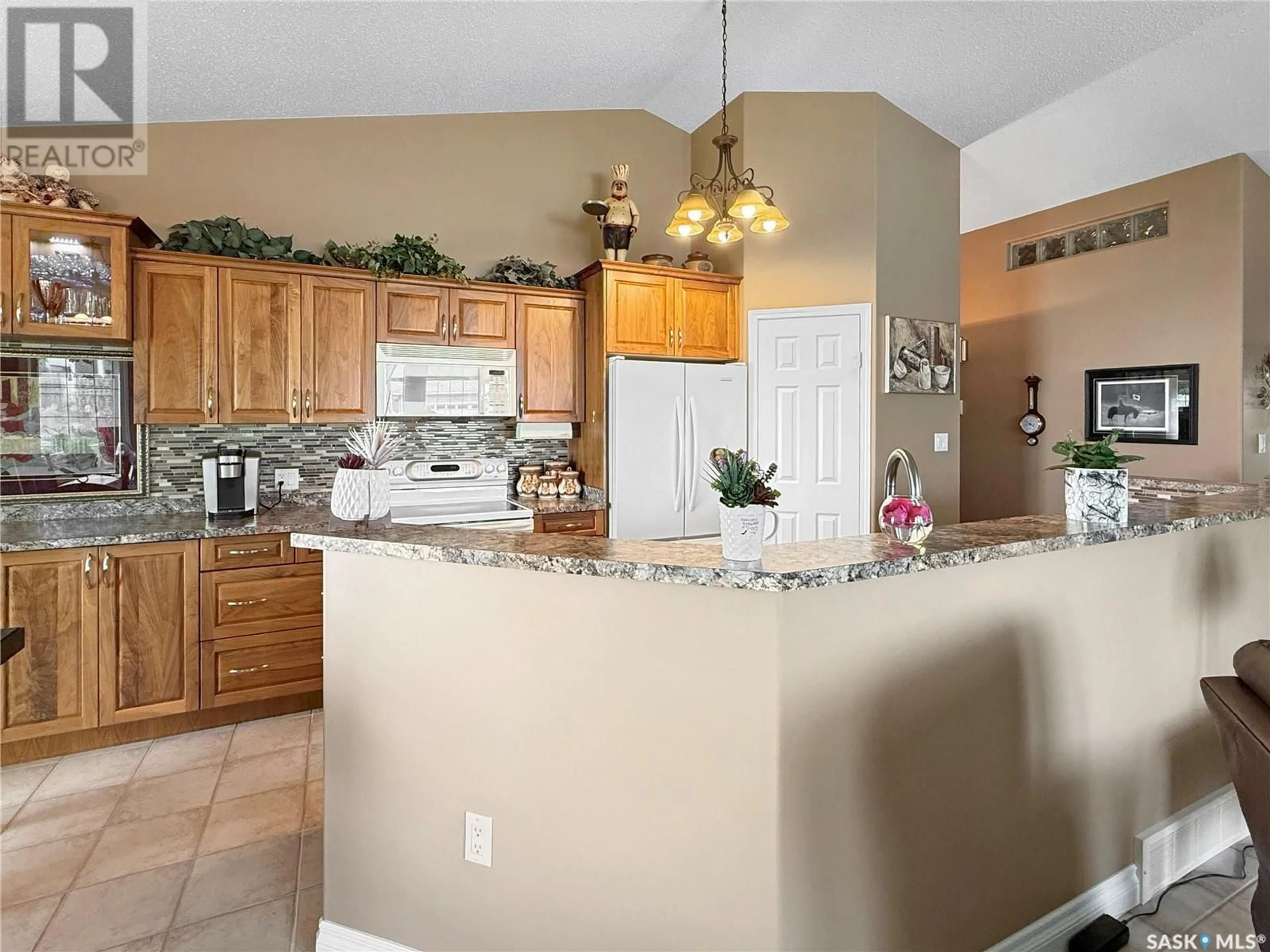 Open concept kitchen, ceramic/tile floor for 1 - 2502 KILLDEER DRIVE, North Battleford Saskatchewan S9A3Z2
