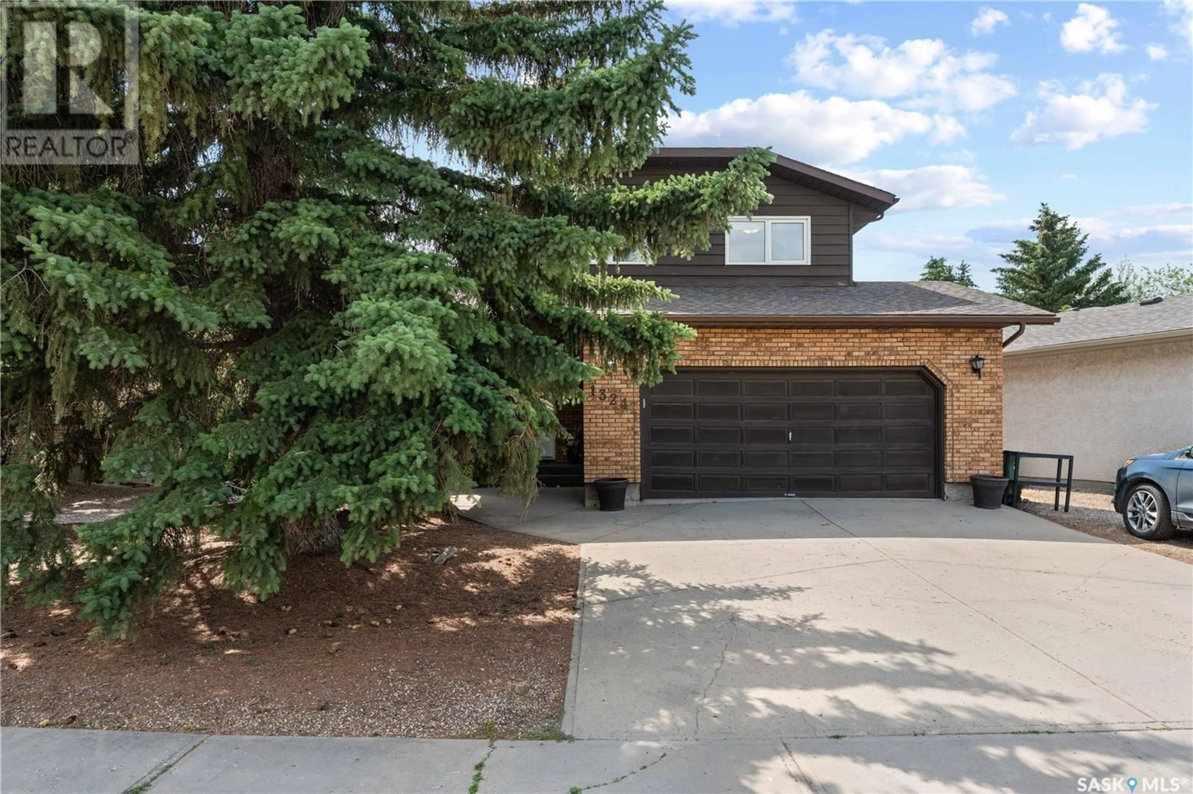 Home with brick exterior material, street for 1324 LAKEWOOD DRIVE, Regina Saskatchewan S4X3L4