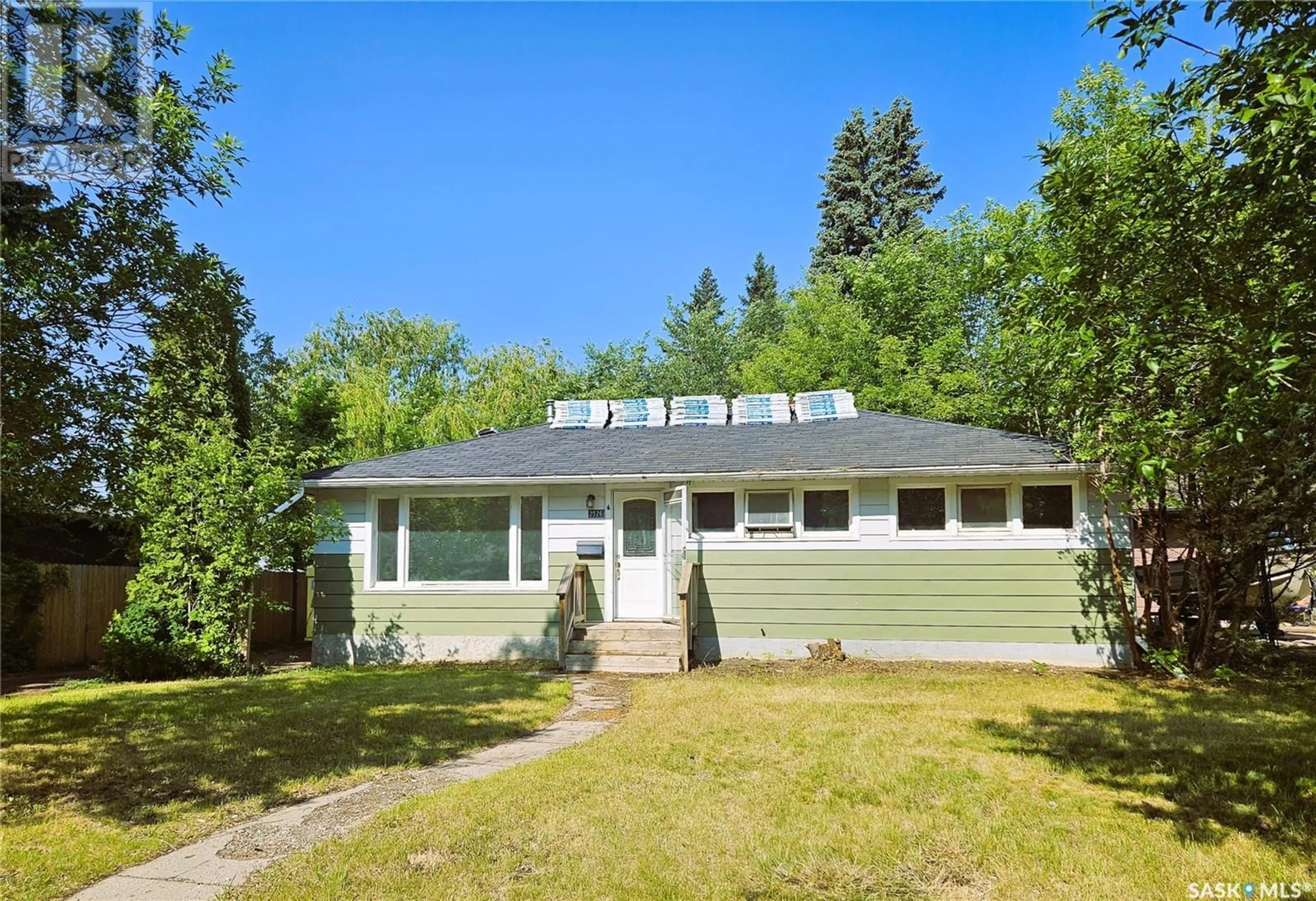Home with vinyl exterior material, street for 2526 BROADWAY AVENUE, Saskatoon Saskatchewan S7J0Z2