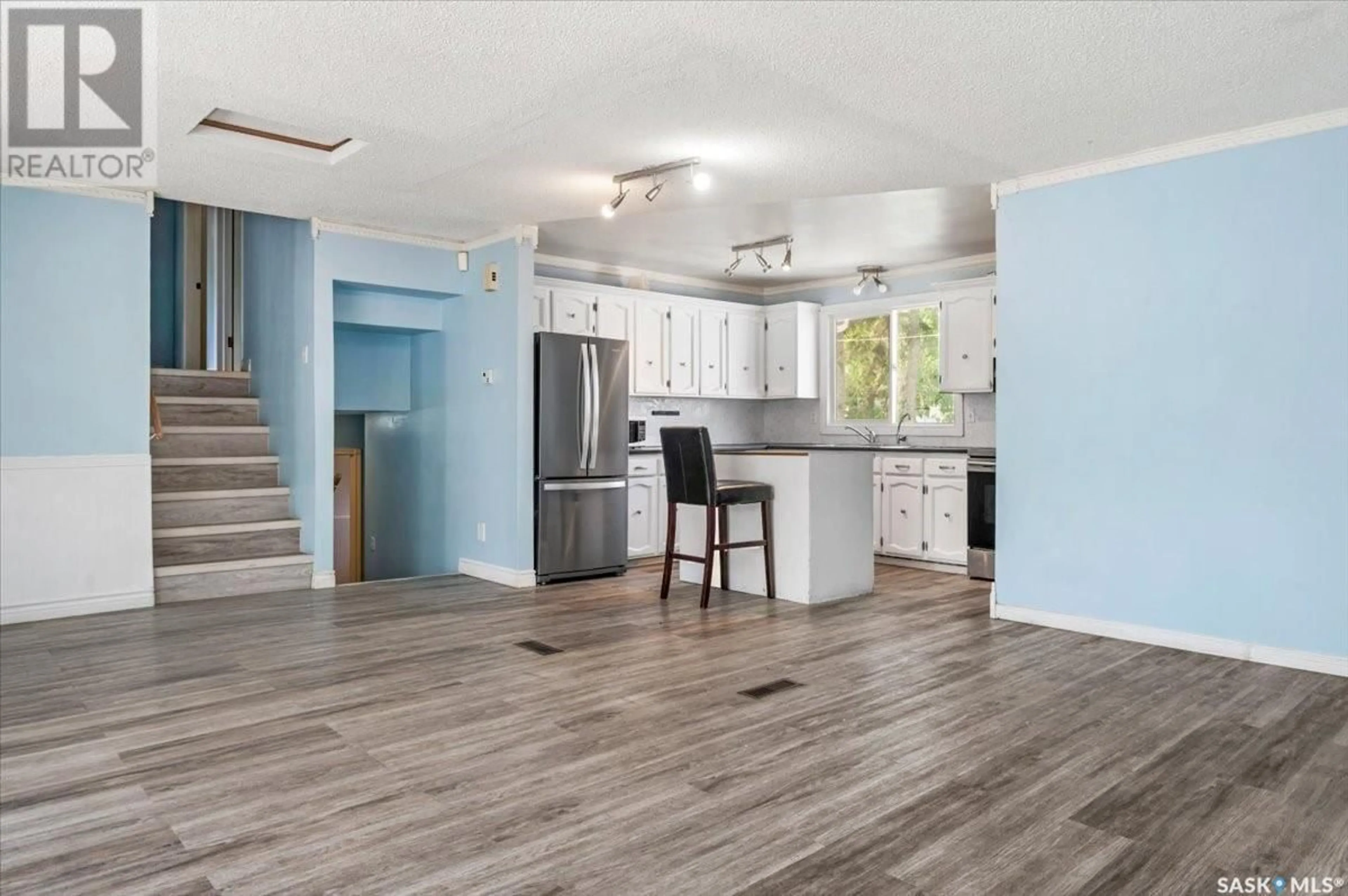 Open concept kitchen, wood/laminate floor for 14 MARQUIS CRESCENT, Regina Saskatchewan S4S6J9