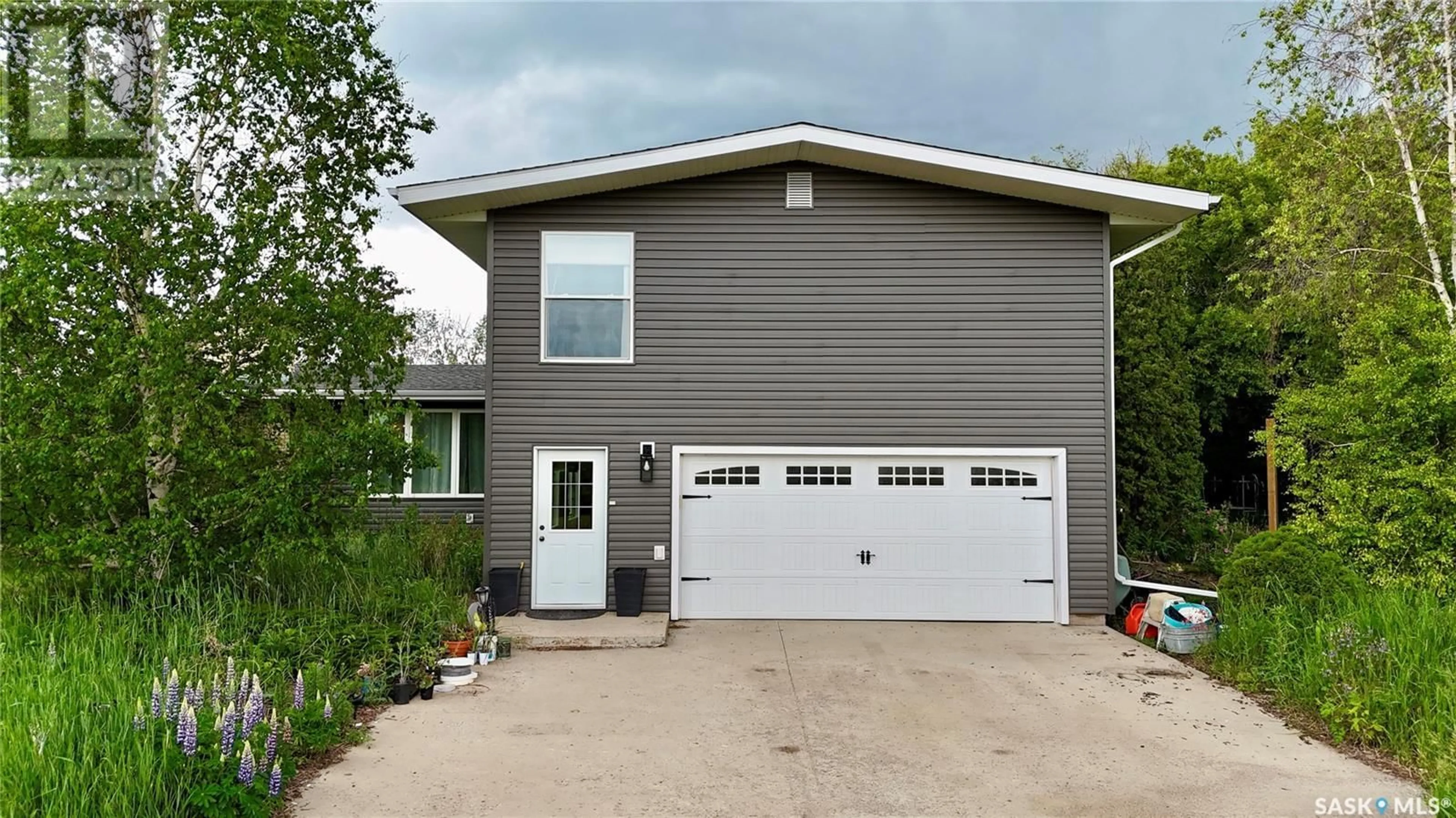 Home with vinyl exterior material, street for COOPER ACREAGE, North Battleford Rm No. 437 Saskatchewan S9A2X3