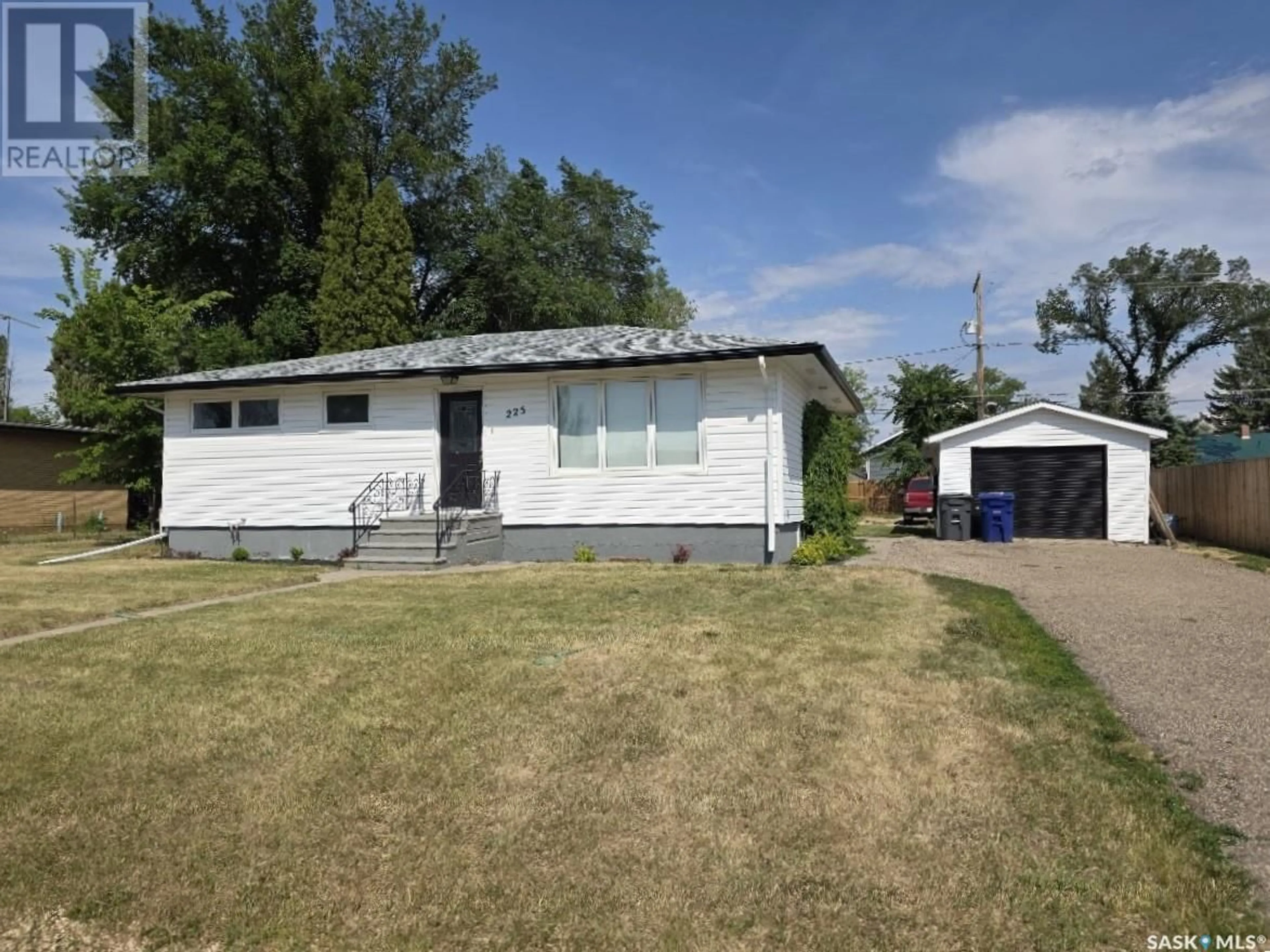 Home with vinyl exterior material, street for 225 SEMPLE STREET, Outlook Saskatchewan S0L2N0