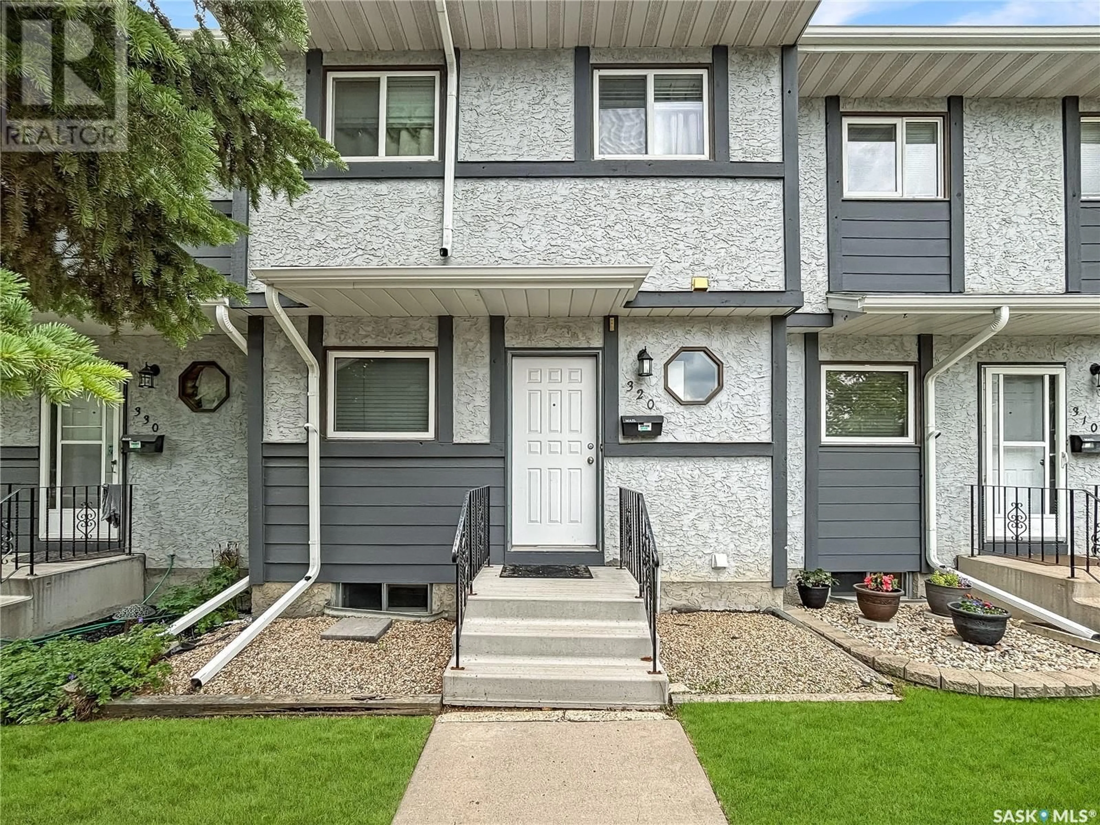Home with vinyl exterior material, street for 140 - 320 MEILICKE ROAD, Saskatoon Saskatchewan S7K7Y5