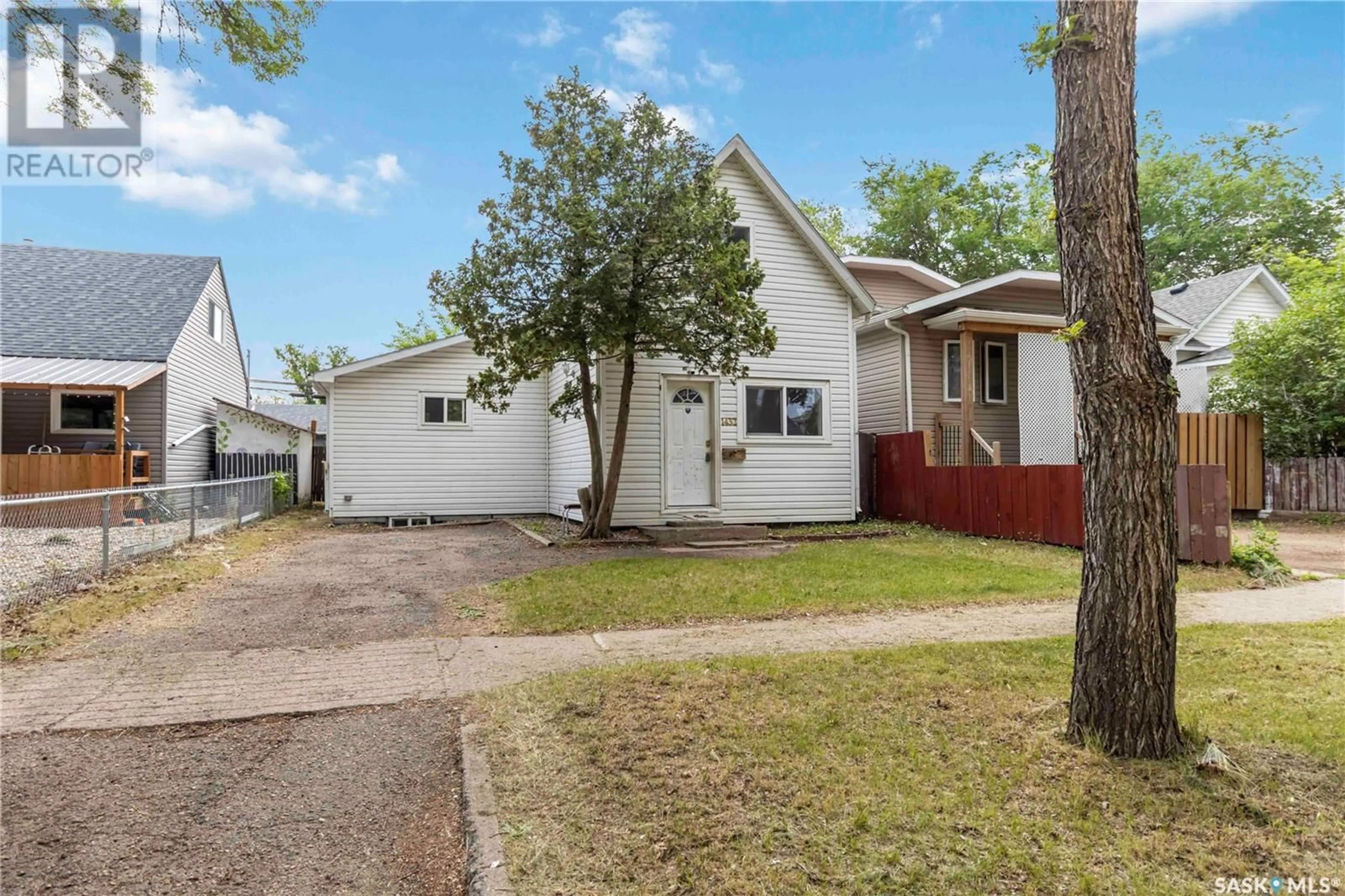 Home with vinyl exterior material, street for 1432 C AVENUE, Saskatoon Saskatchewan S7L1L1