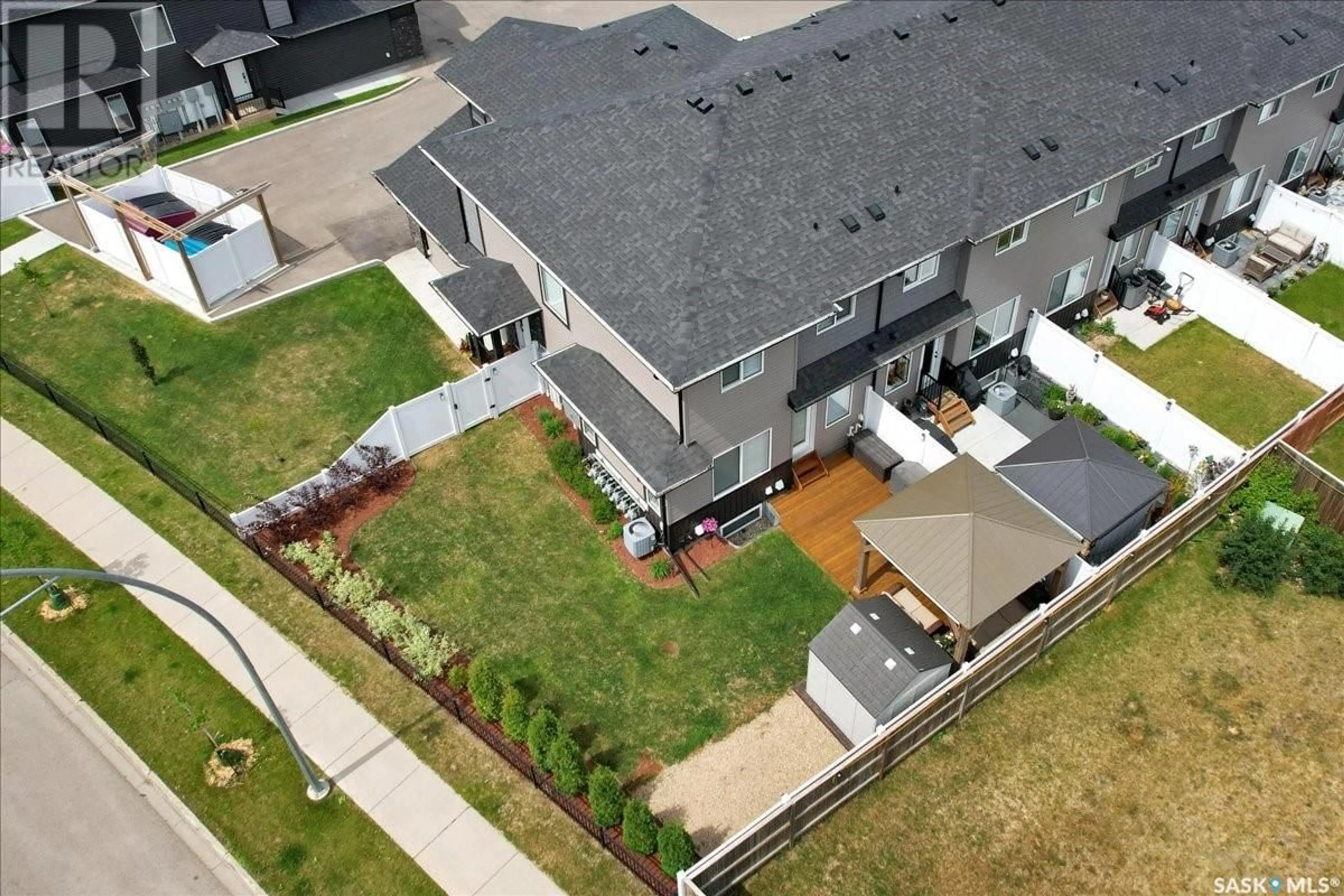 A pic from outside/outdoor area/front of a property/back of a property/a pic from drone, street for 12 525 MAHABIR LANE, Saskatoon Saskatchewan S7W1G1