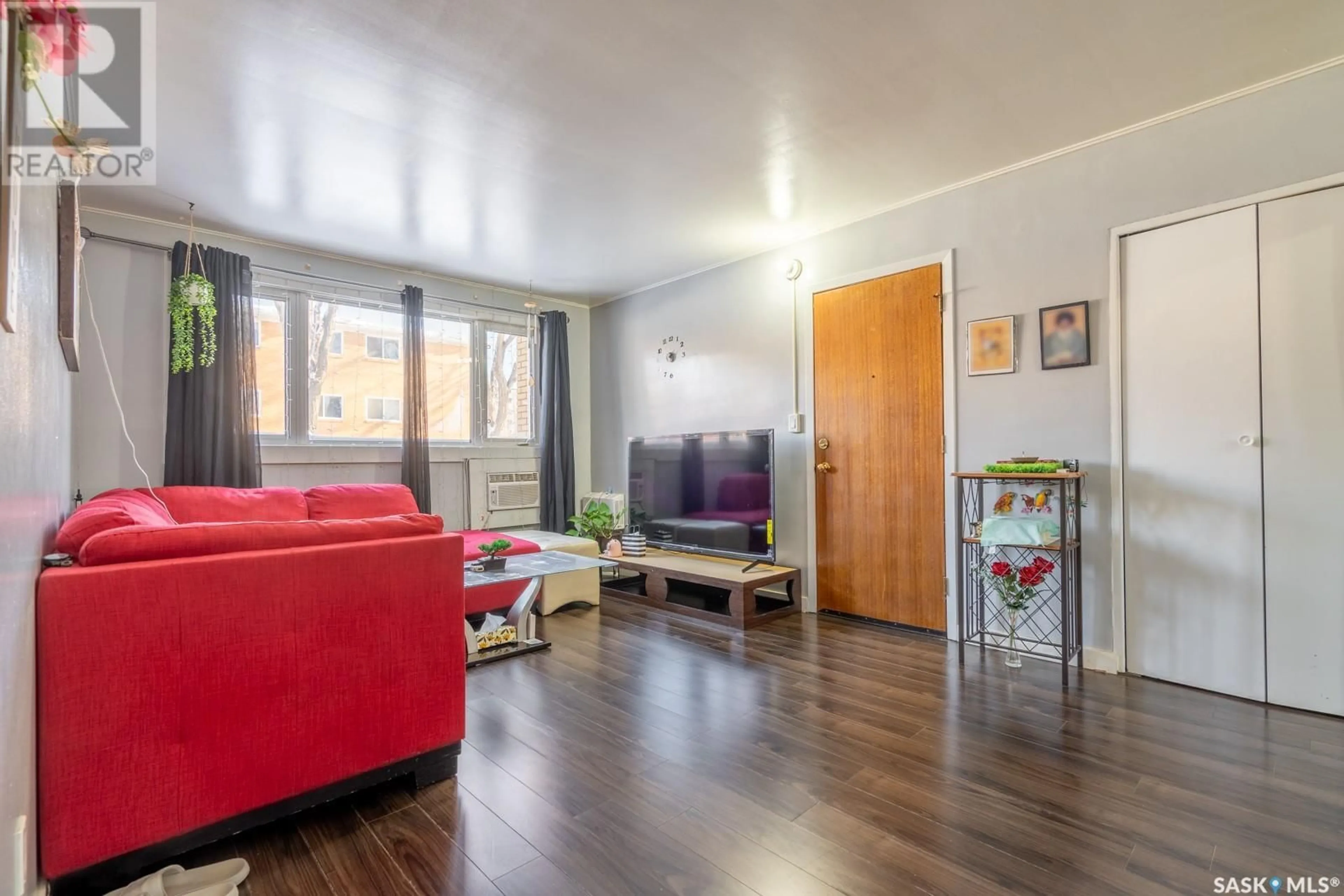 Living room with furniture, wood/laminate floor for 3970 RETALLACK STREET, Regina Saskatchewan S4S3B9