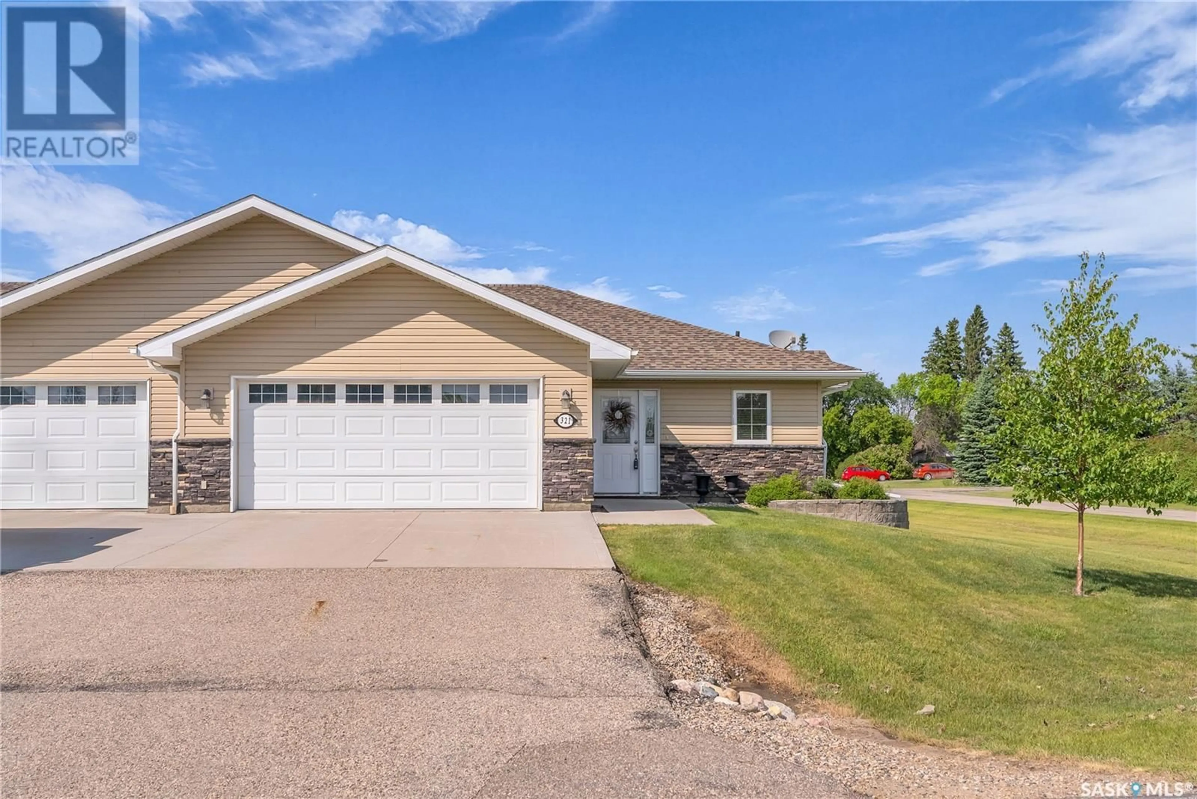Home with vinyl exterior material, street for 321 2ND STREET, Waldheim Saskatchewan S0K4R0