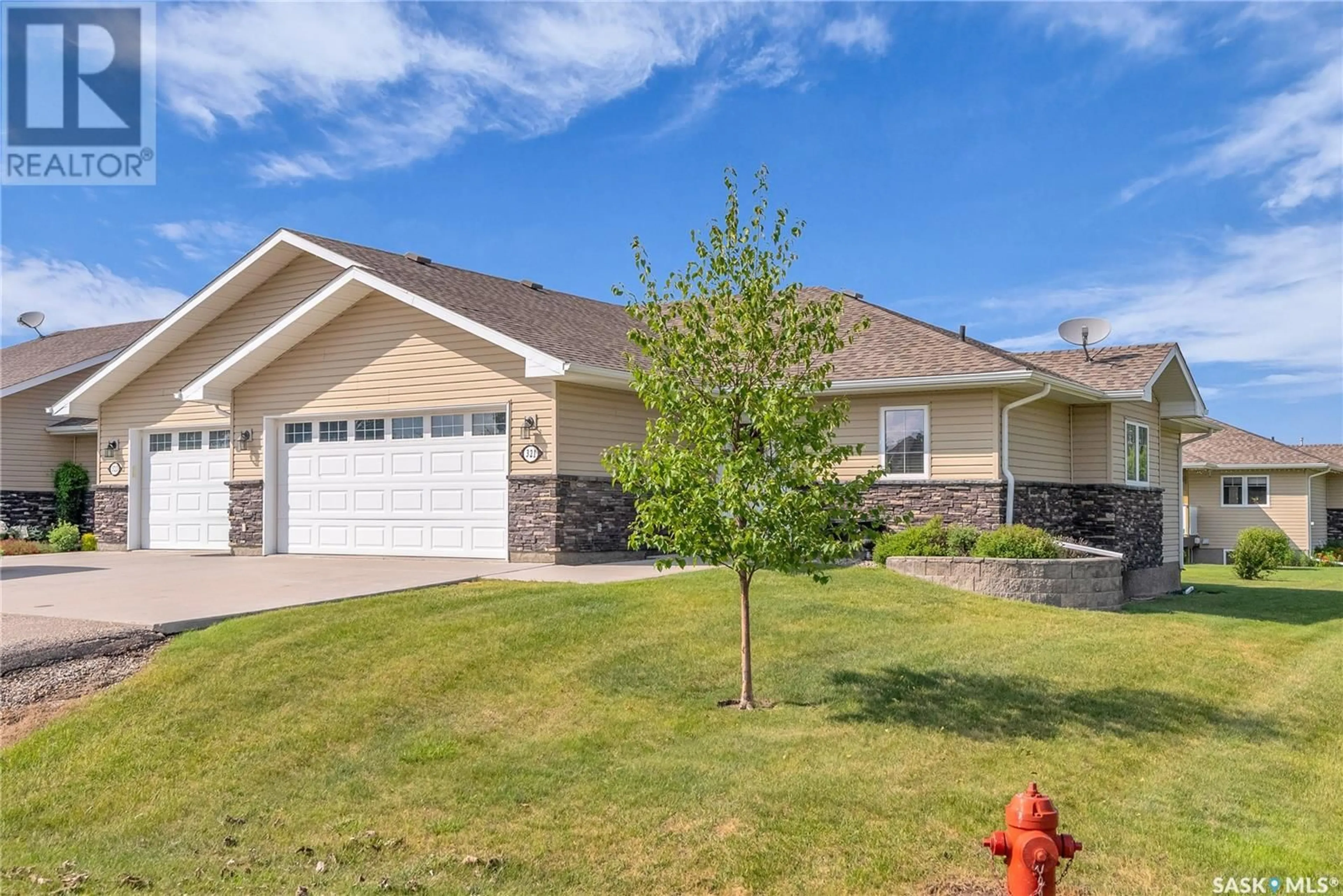 Home with vinyl exterior material, street for 321 2ND STREET, Waldheim Saskatchewan S0K4R0
