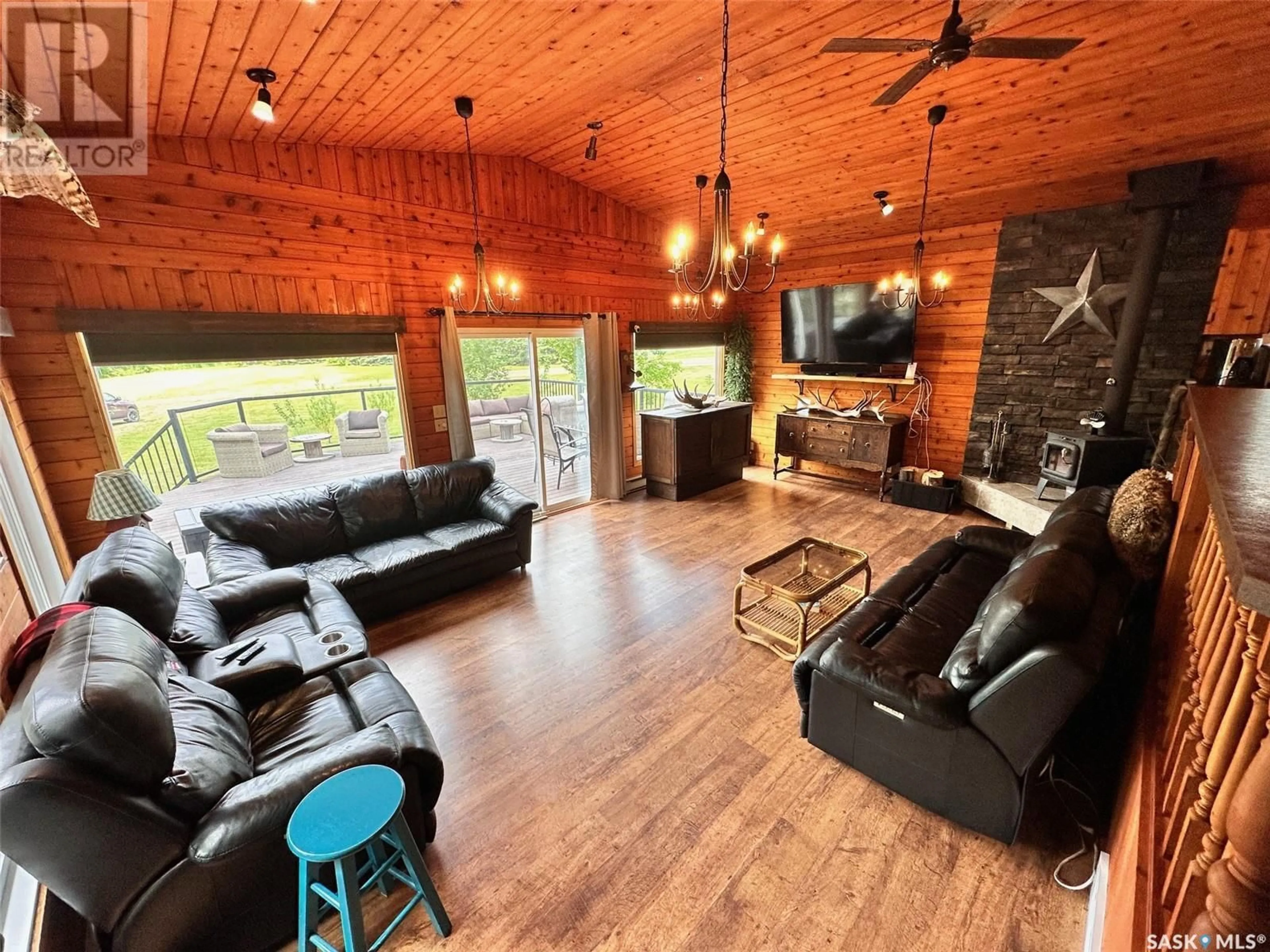 Living room with furniture, wood/laminate floor for 232 SHELL LAKE CRESCENT, Echo Bay Saskatchewan S0J2G0