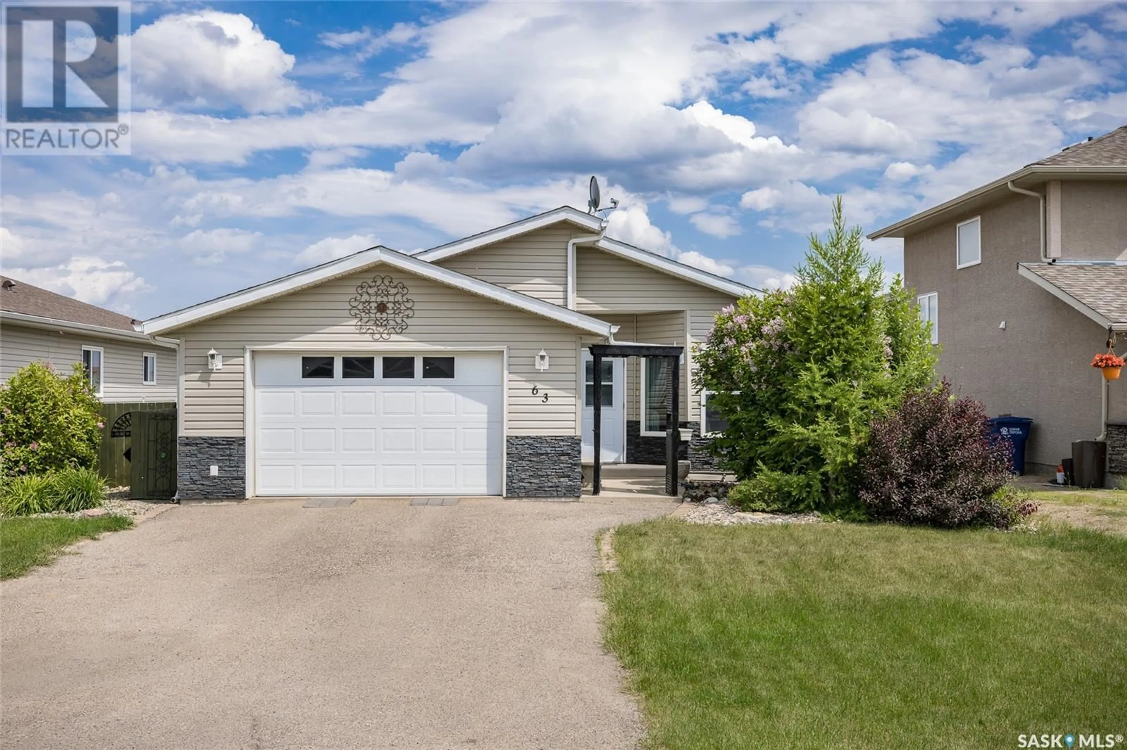 Home with vinyl exterior material, street for 63 PARADISE CIRCLE, White City Saskatchewan S4L0A1