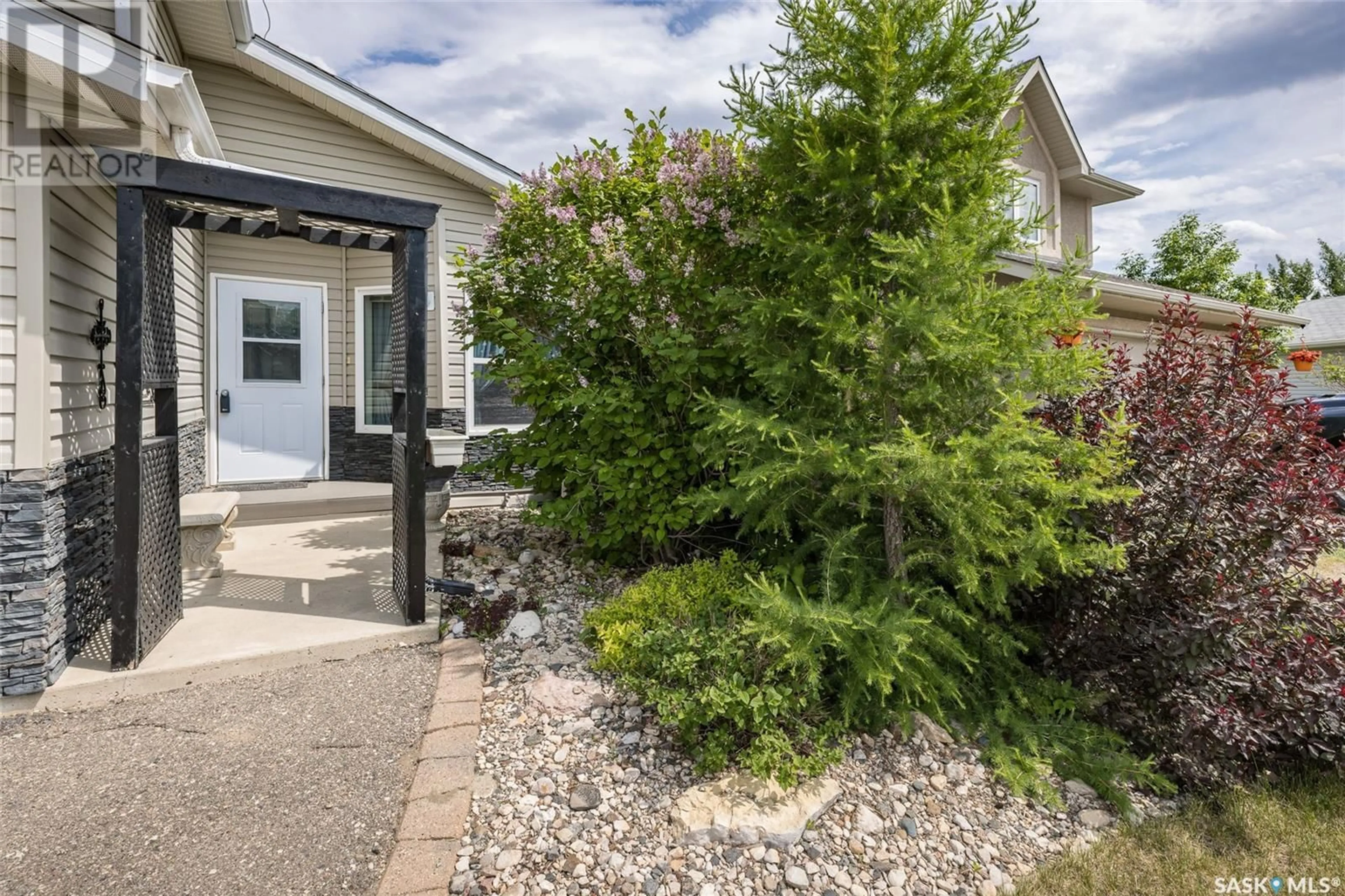 Patio, street for 63 PARADISE CIRCLE, White City Saskatchewan S4L0A1