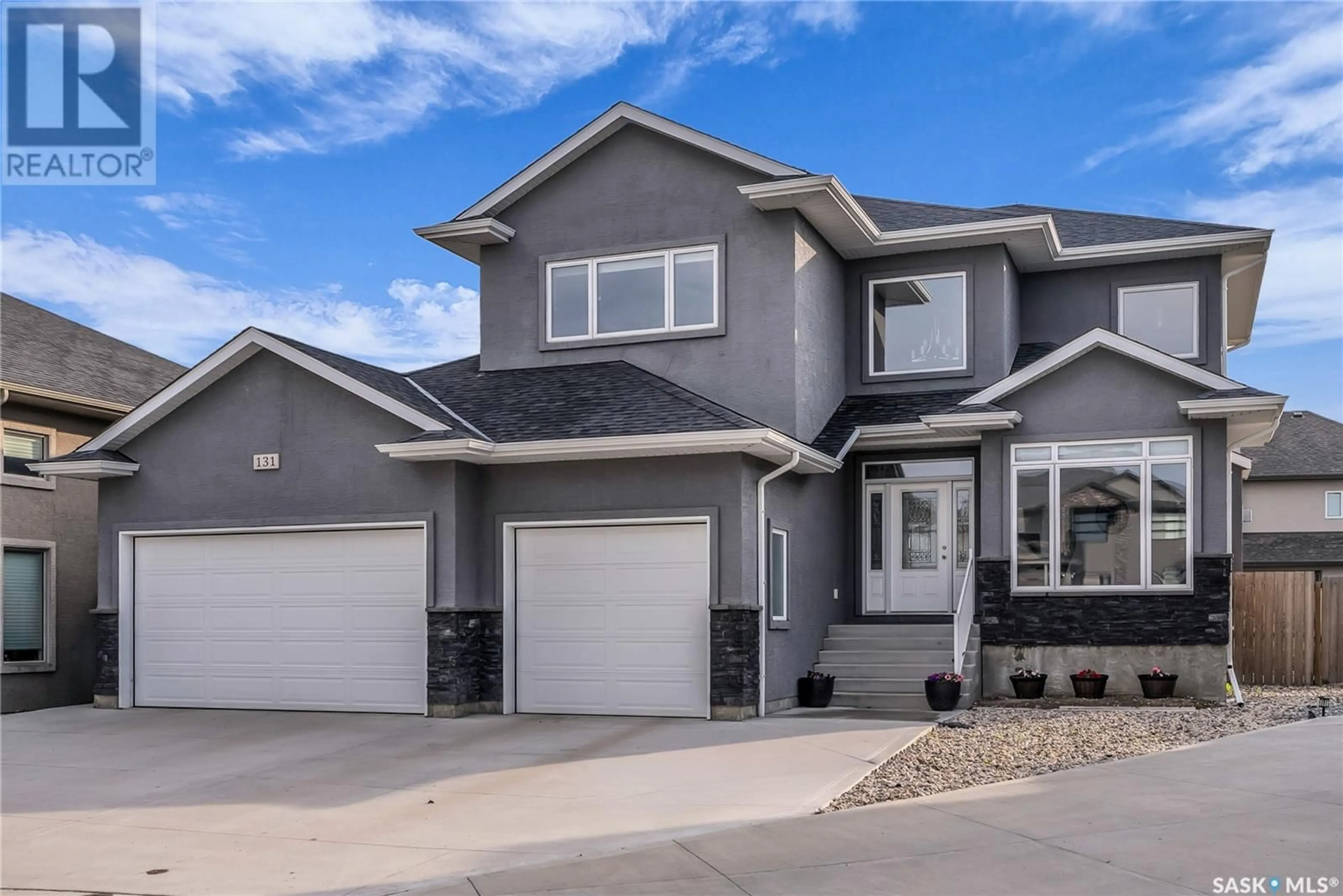 Home with vinyl exterior material, street for 131 ROCHELLE BAY, Saskatoon Saskatchewan S7V0H6