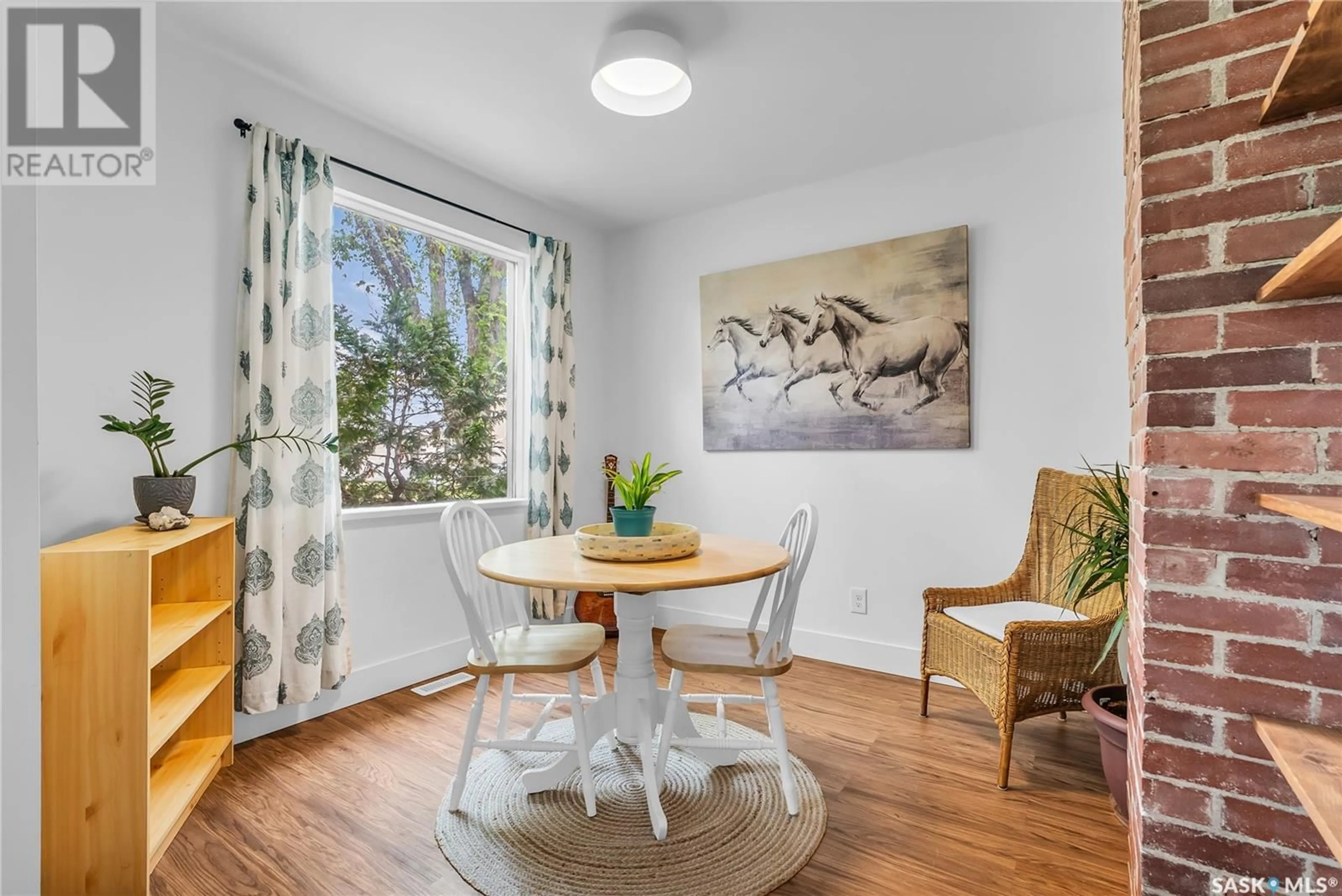 Dining room, wood/laminate floor for 805 J AVENUE, Saskatoon Saskatchewan S7M2B4