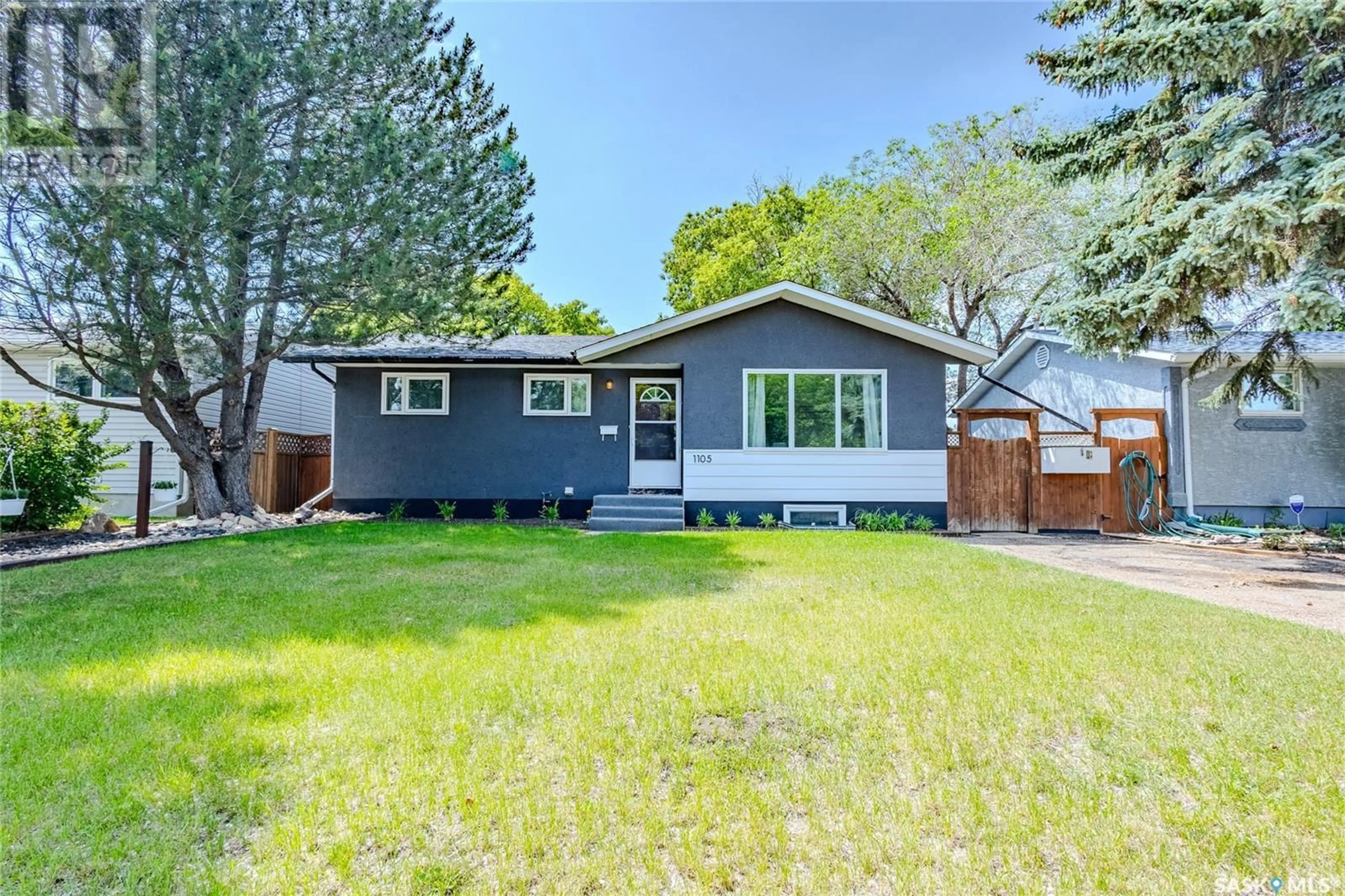 Home with vinyl exterior material, street for 1105 MCNAUGHTON AVENUE, Saskatoon Saskatchewan S7M3X6