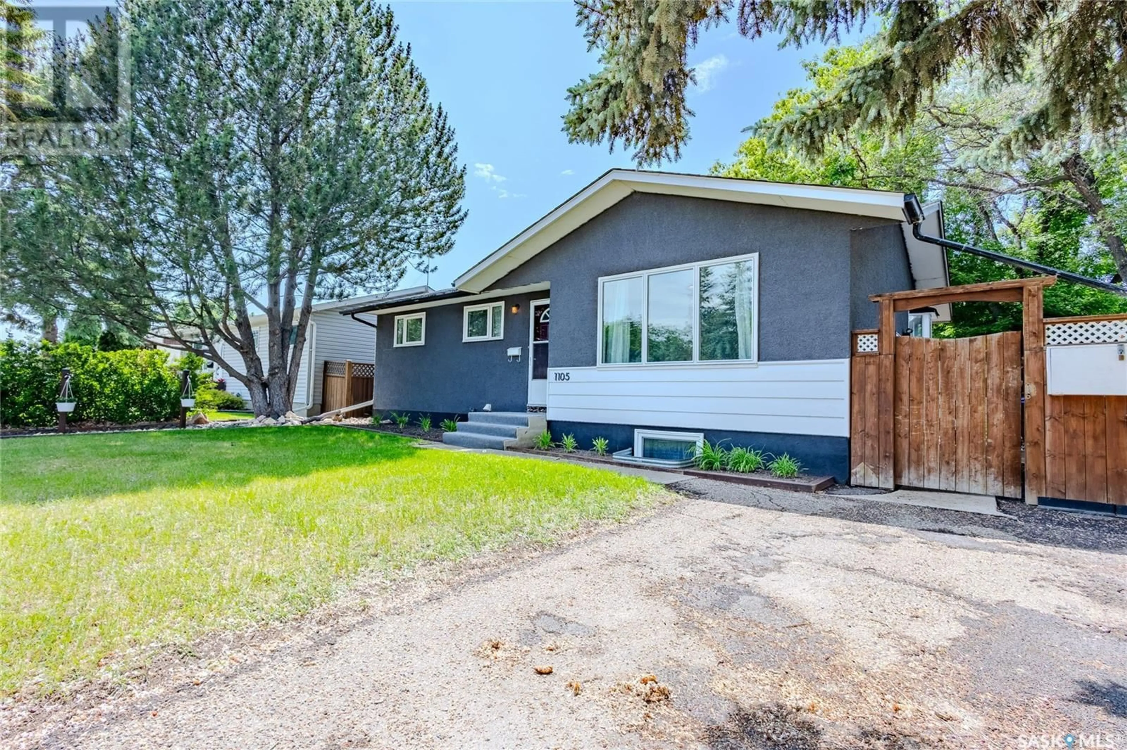 Home with vinyl exterior material, street for 1105 MCNAUGHTON AVENUE, Saskatoon Saskatchewan S7M3X6
