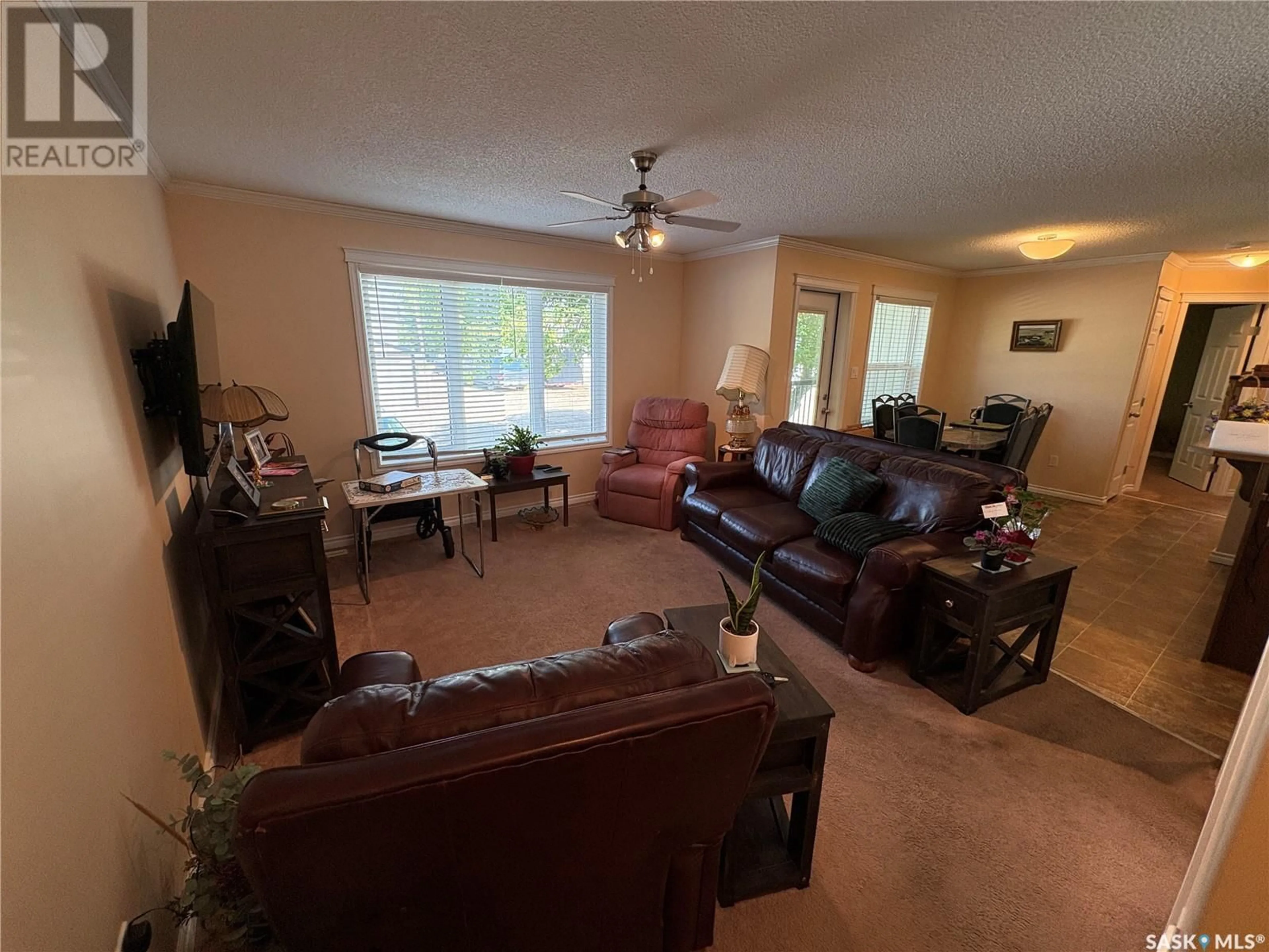 Living room with furniture, unknown for 103 - 120 WELLS AVENUE, Langenburg Saskatchewan S0A2A0