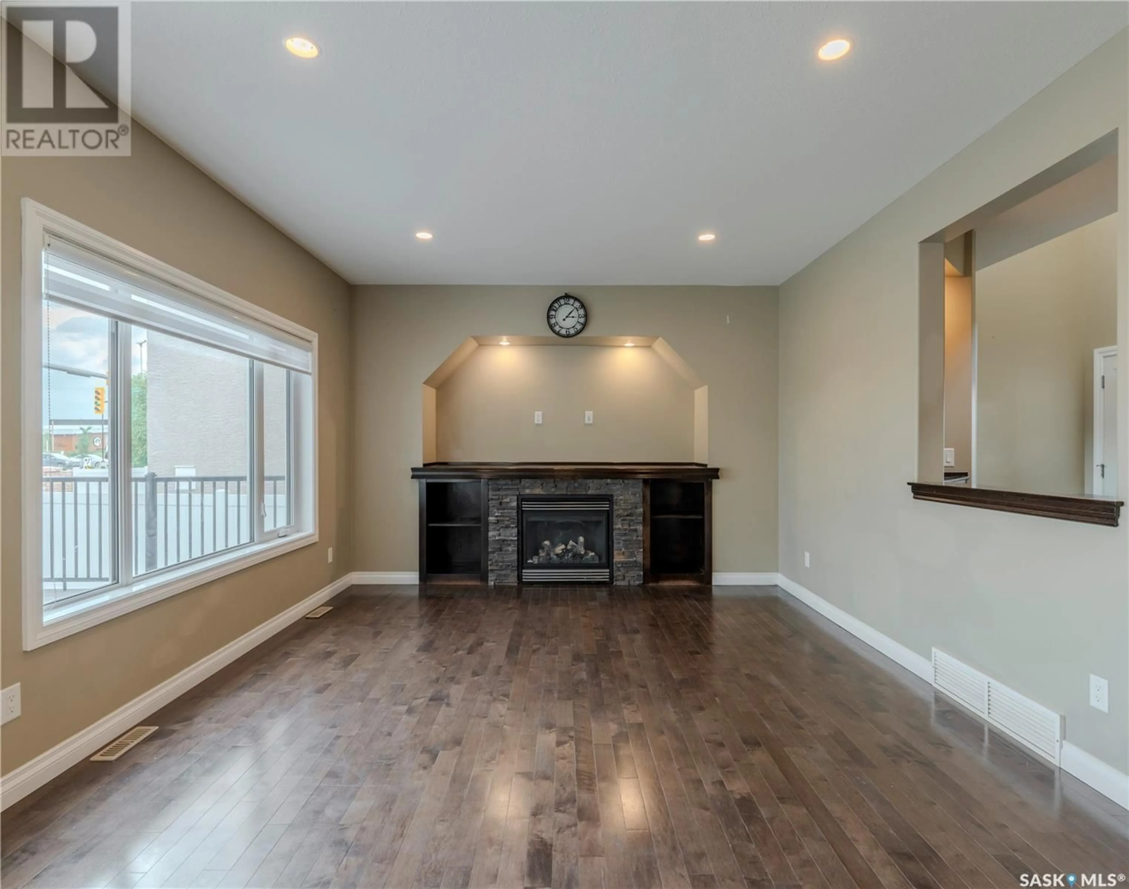Living room with furniture, wood/laminate floor for 5145 CANUCK CRESCENT, Regina Saskatchewan S4W0H1