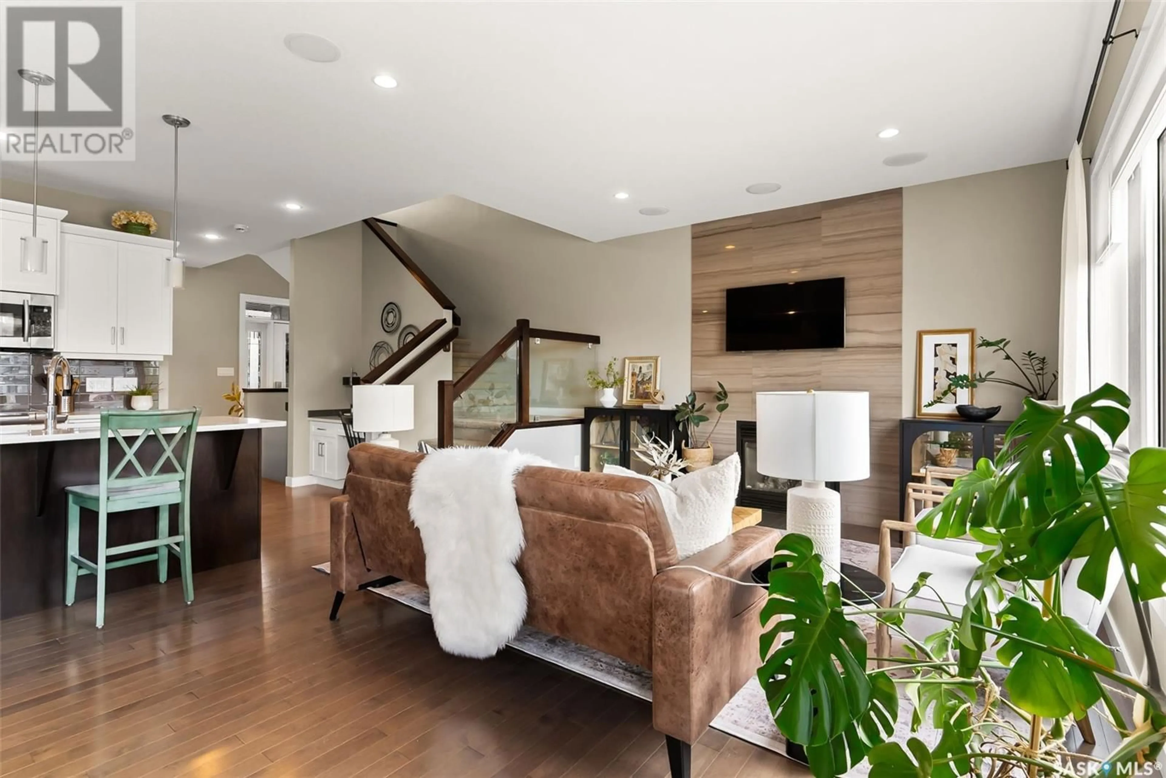 Living room with furniture, wood/laminate floor for 3510 GREEN BROOK ROAD, Regina Saskatchewan S4V1R5
