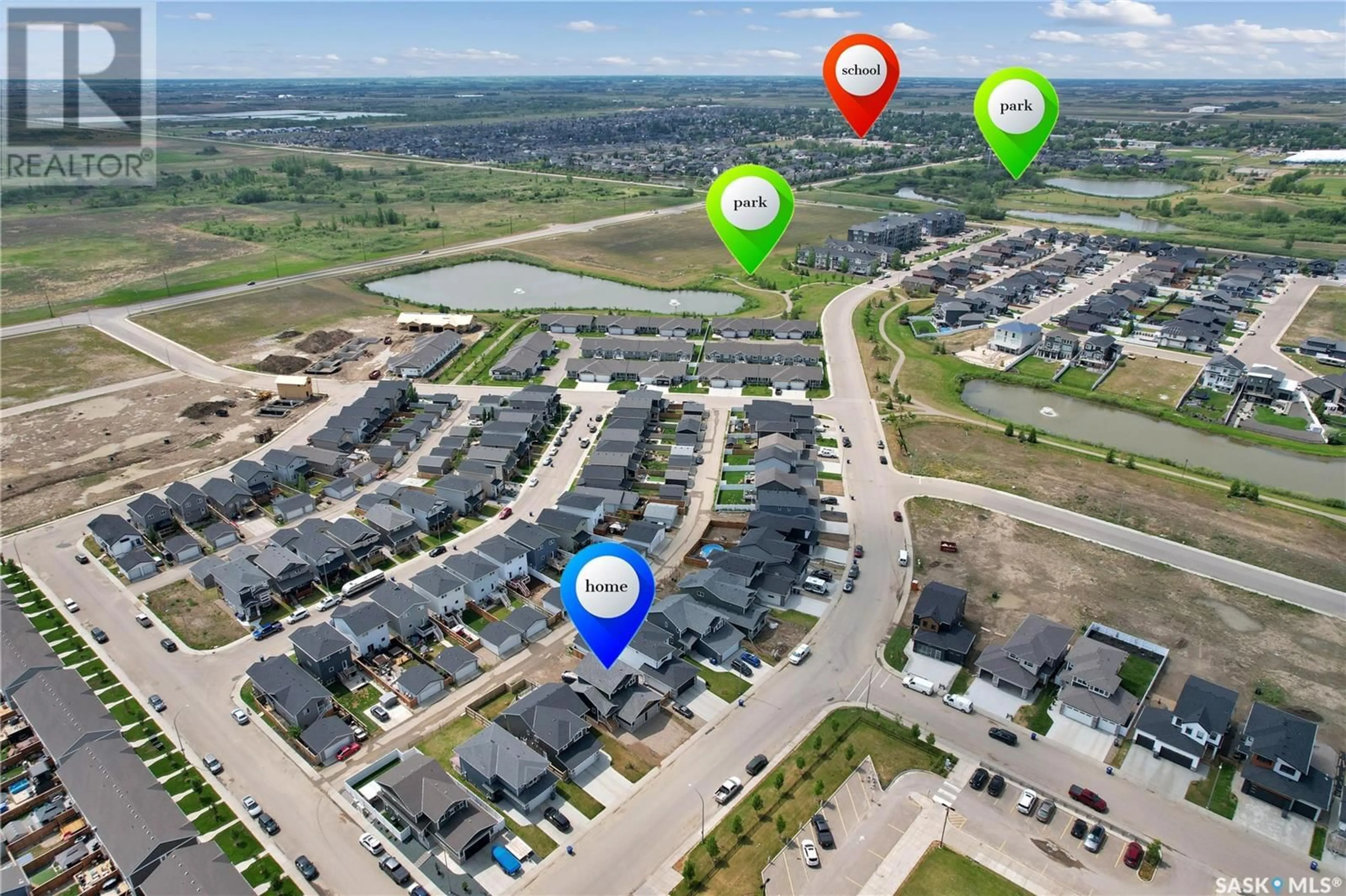 A pic from outside/outdoor area/front of a property/back of a property/a pic from drone, street for 1352 PARR HILL DRIVE, Martensville Saskatchewan S0K2T1