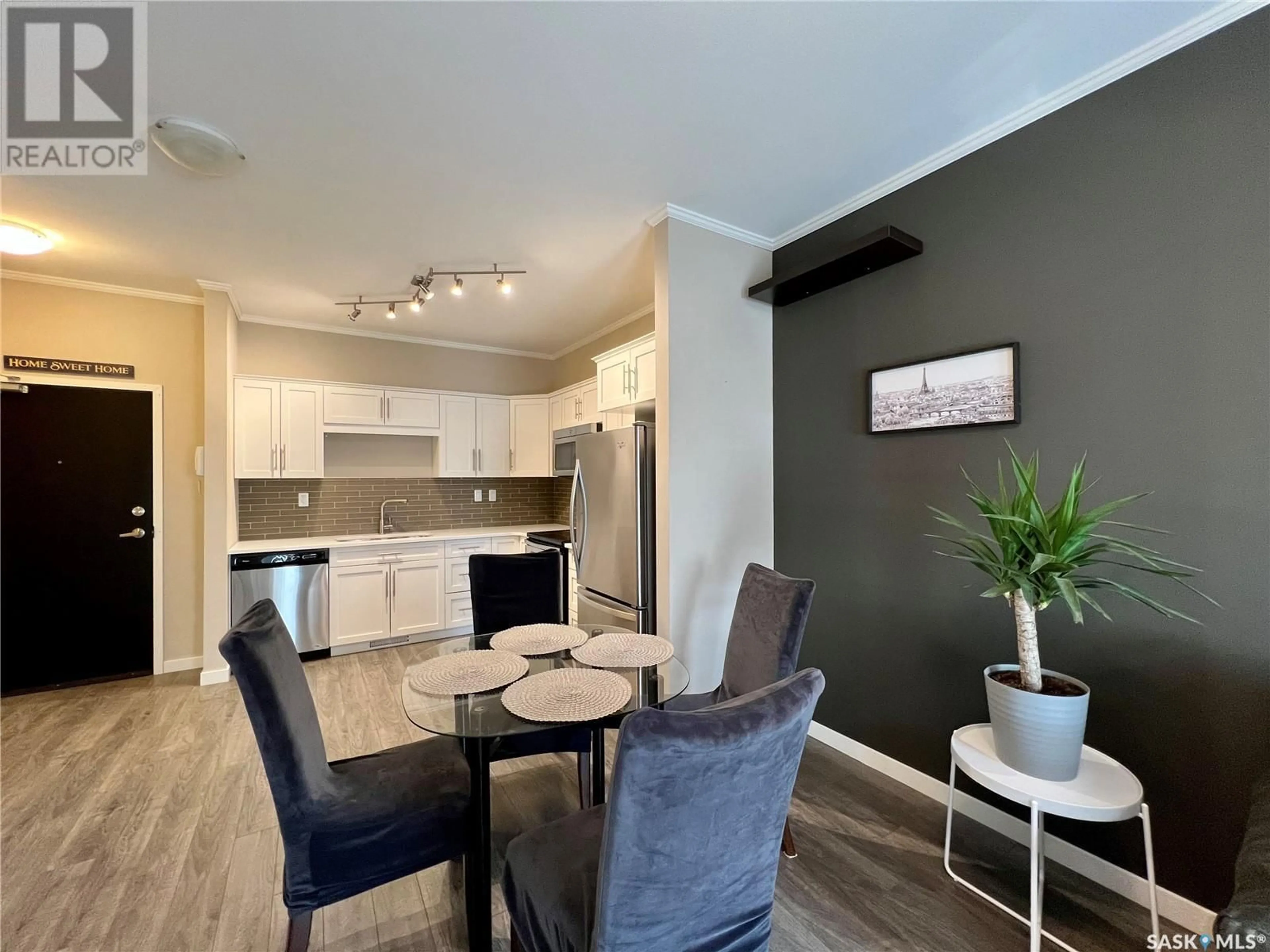 Open concept kitchen, wood/laminate floor for 110 - 720 BALTZAN BOULEVARD, Saskatoon Saskatchewan S7W0G6