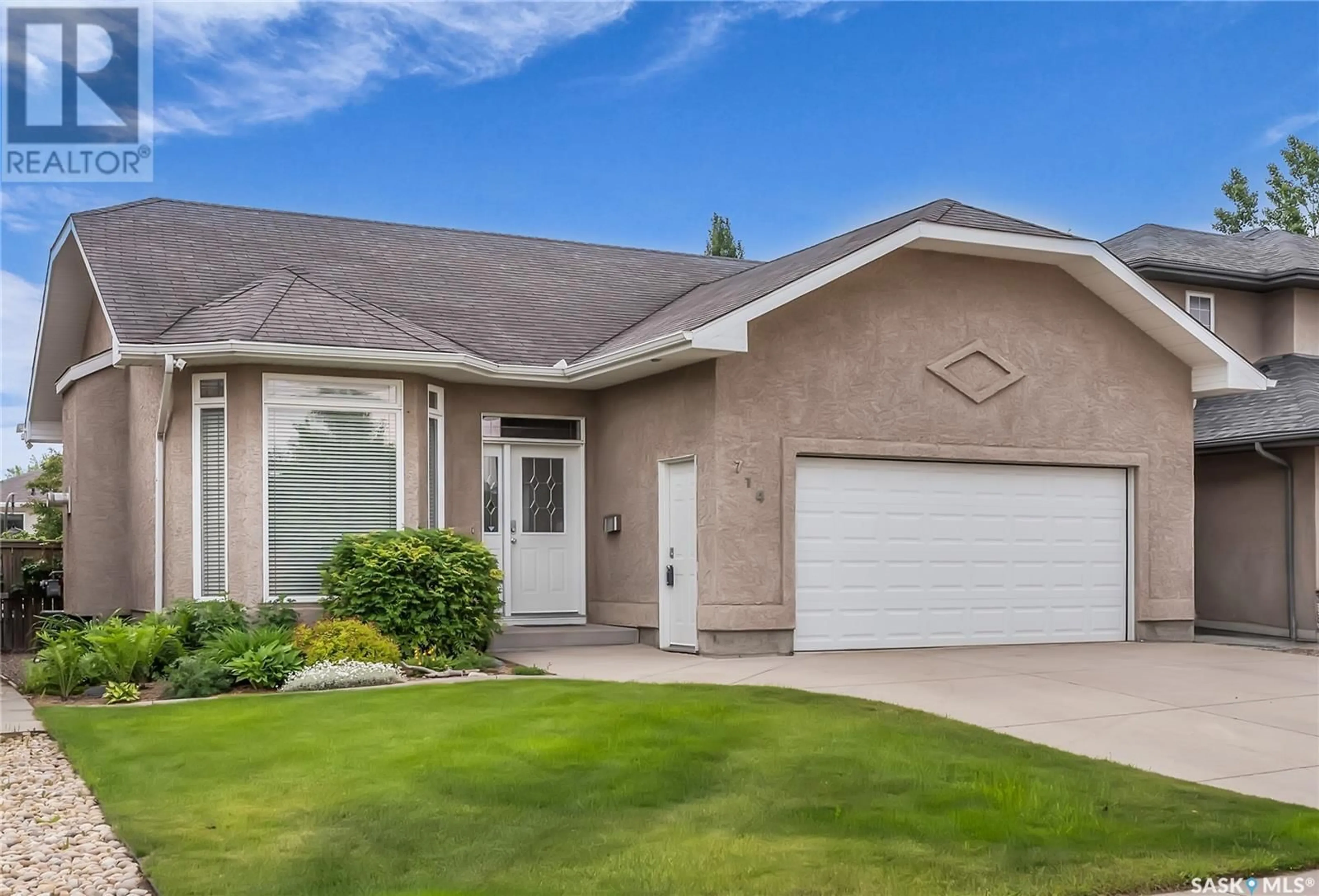 Home with vinyl exterior material, street for 714 MAGUIRE CRESCENT, Saskatoon Saskatchewan S7W1A3