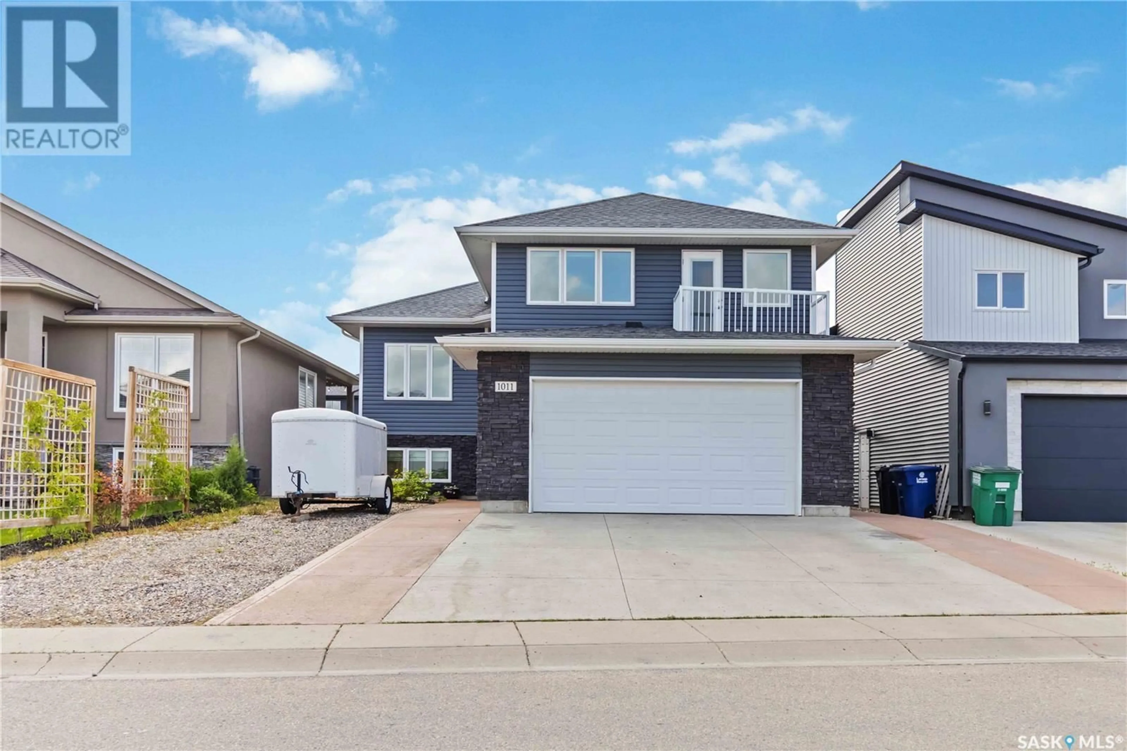 Home with vinyl exterior material, street for 1011 KLOPPENBURG BEND, Saskatoon Saskatchewan S7W0P4