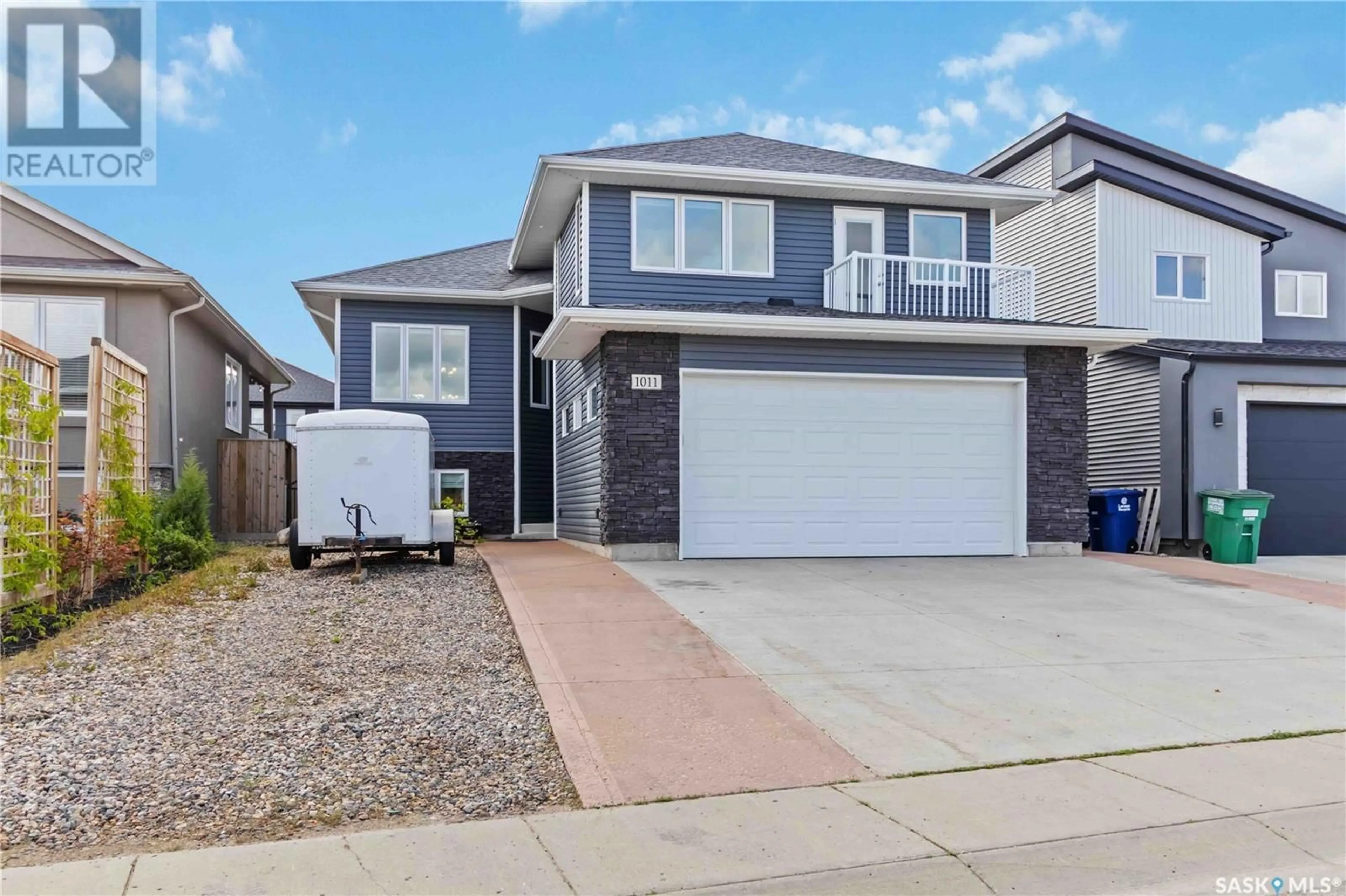 Home with vinyl exterior material, street for 1011 KLOPPENBURG BEND, Saskatoon Saskatchewan S7W0P4