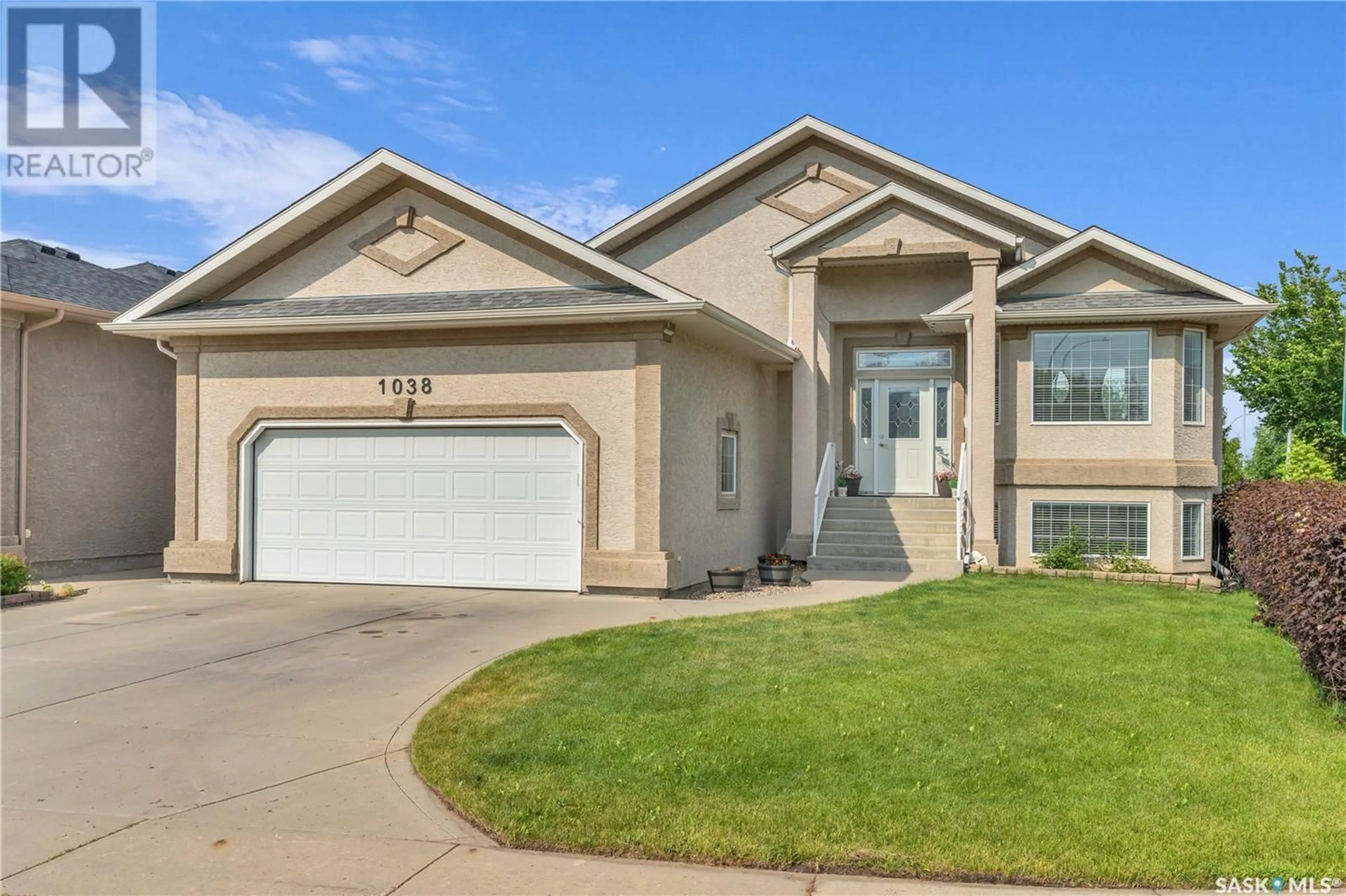Home with vinyl exterior material, street for 1038 BROOKHURST CRESCENT, Saskatoon Saskatchewan S7V1G6