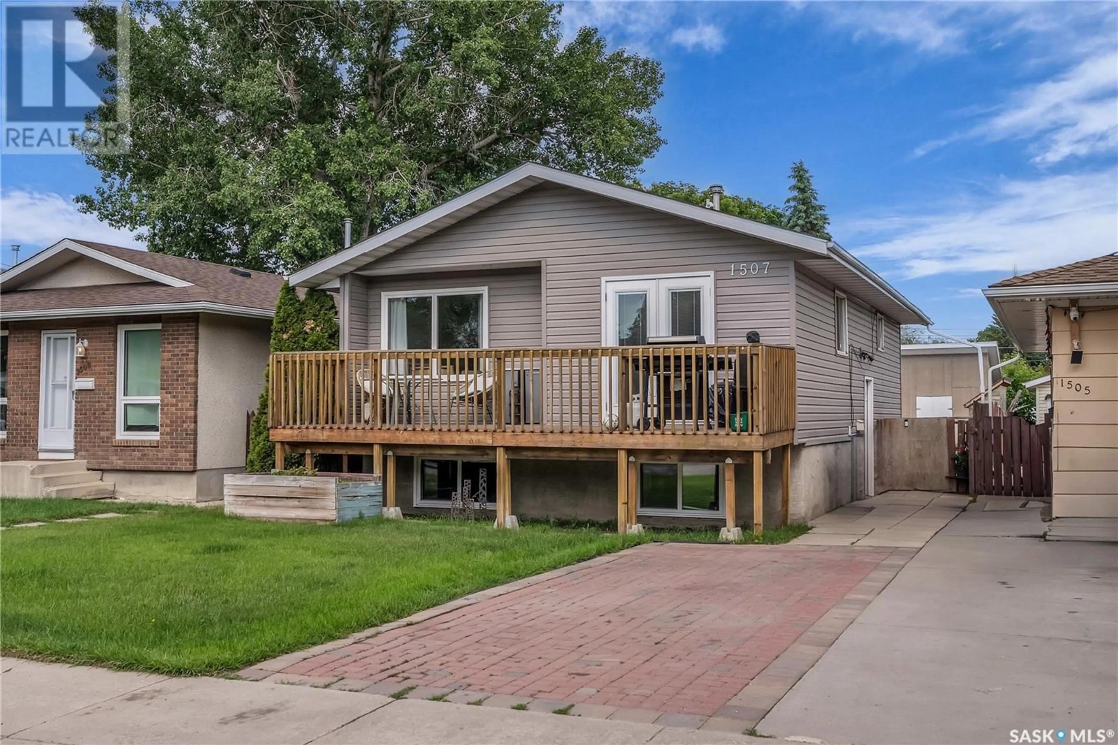 Home with vinyl exterior material, street for 1507 LAURA AVENUE, Saskatoon Saskatchewan S7N2R8
