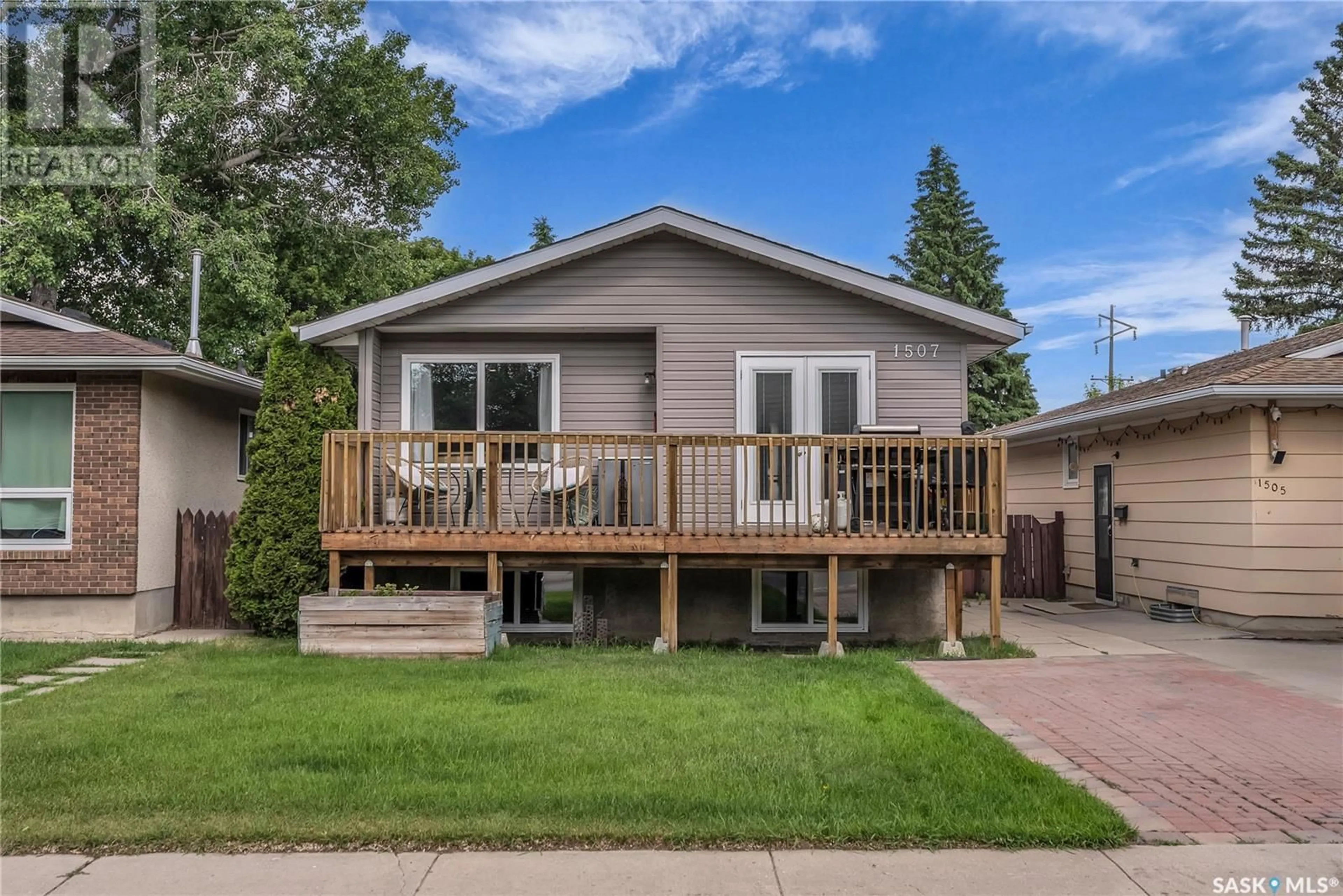 Home with vinyl exterior material, street for 1507 LAURA AVENUE, Saskatoon Saskatchewan S7N2R8