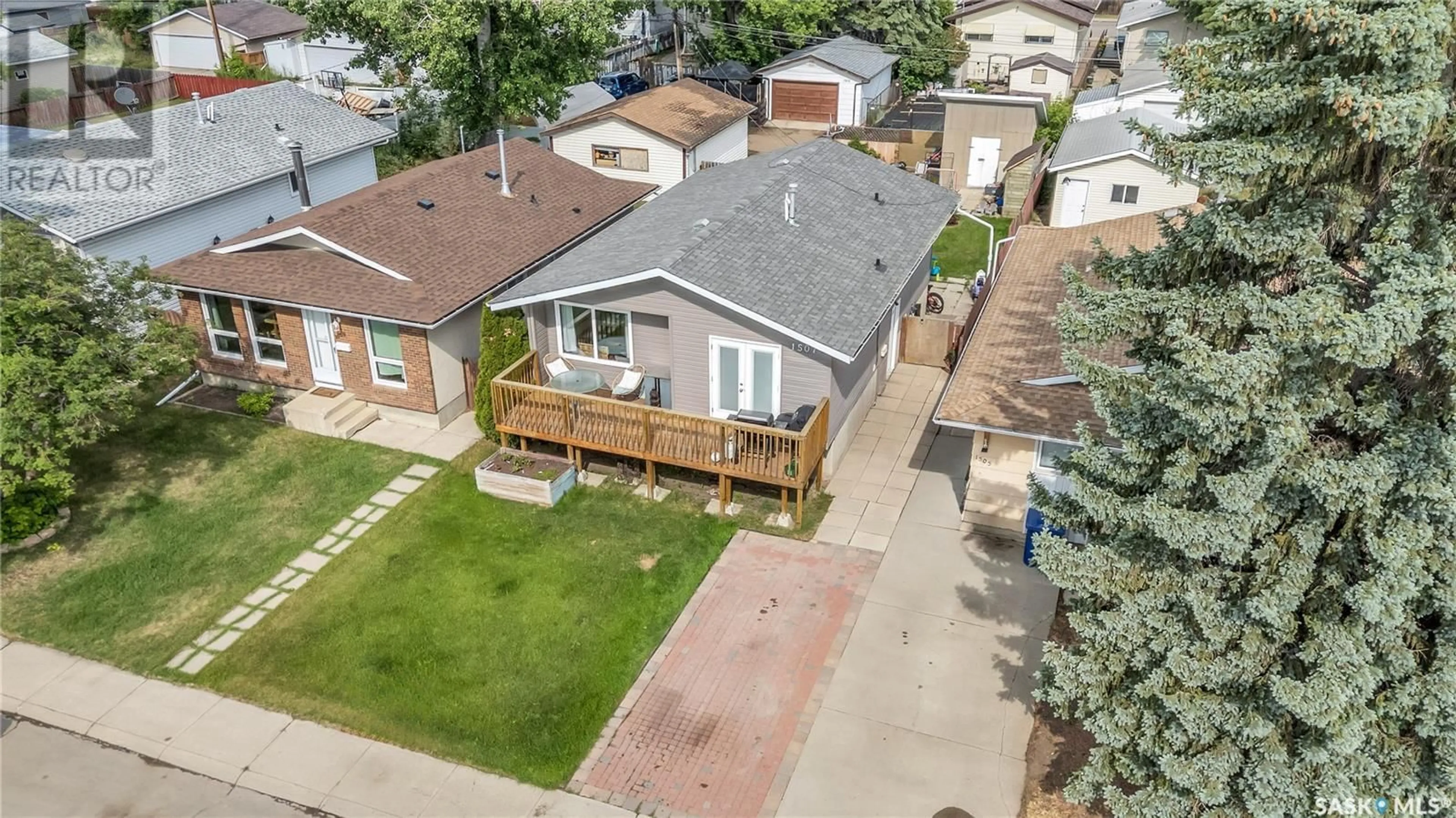 A pic from outside/outdoor area/front of a property/back of a property/a pic from drone, street for 1507 LAURA AVENUE, Saskatoon Saskatchewan S7N2R8