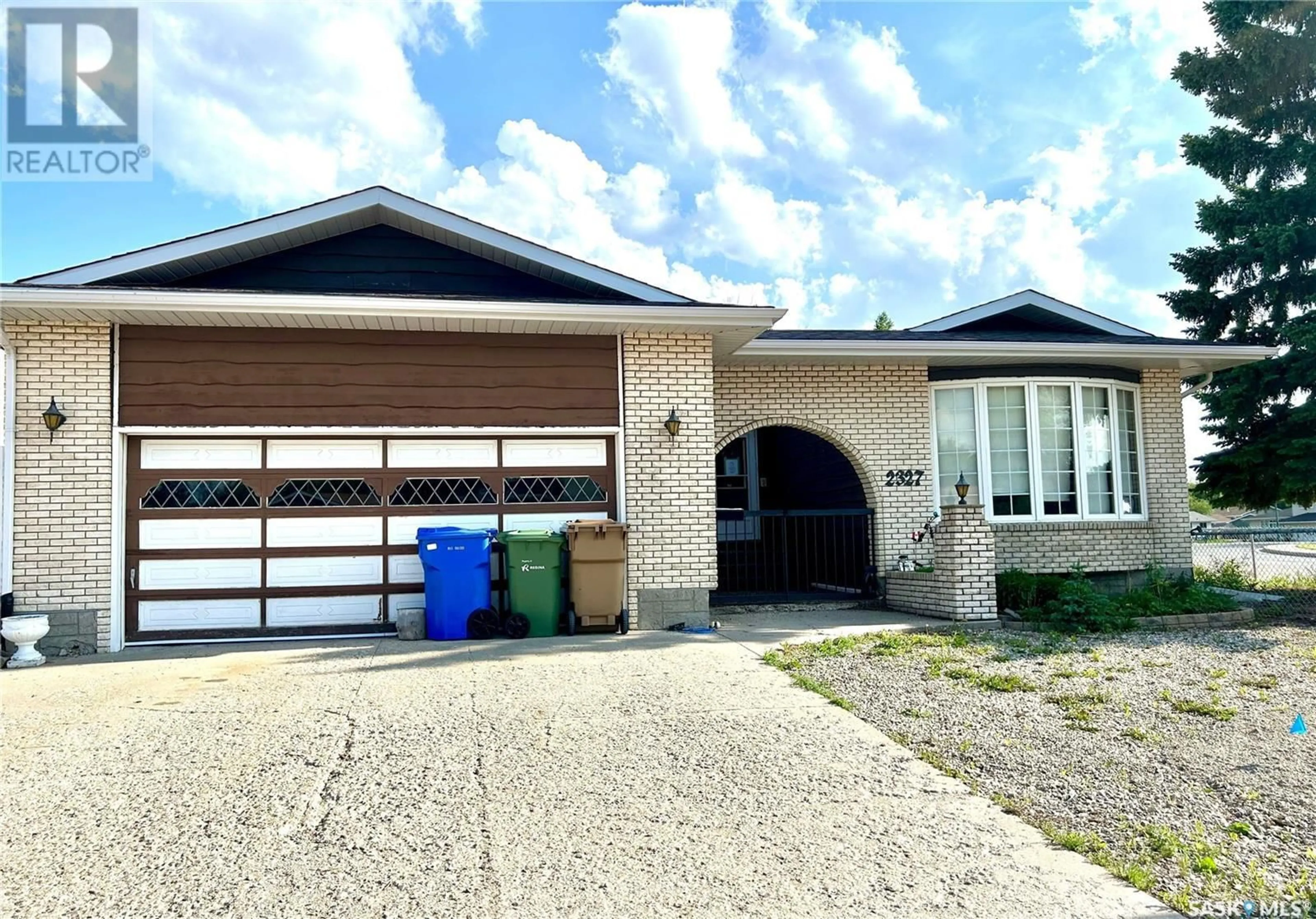 Home with vinyl exterior material, street for 2327 12TH AVENUE, Regina Saskatchewan S4R7J9