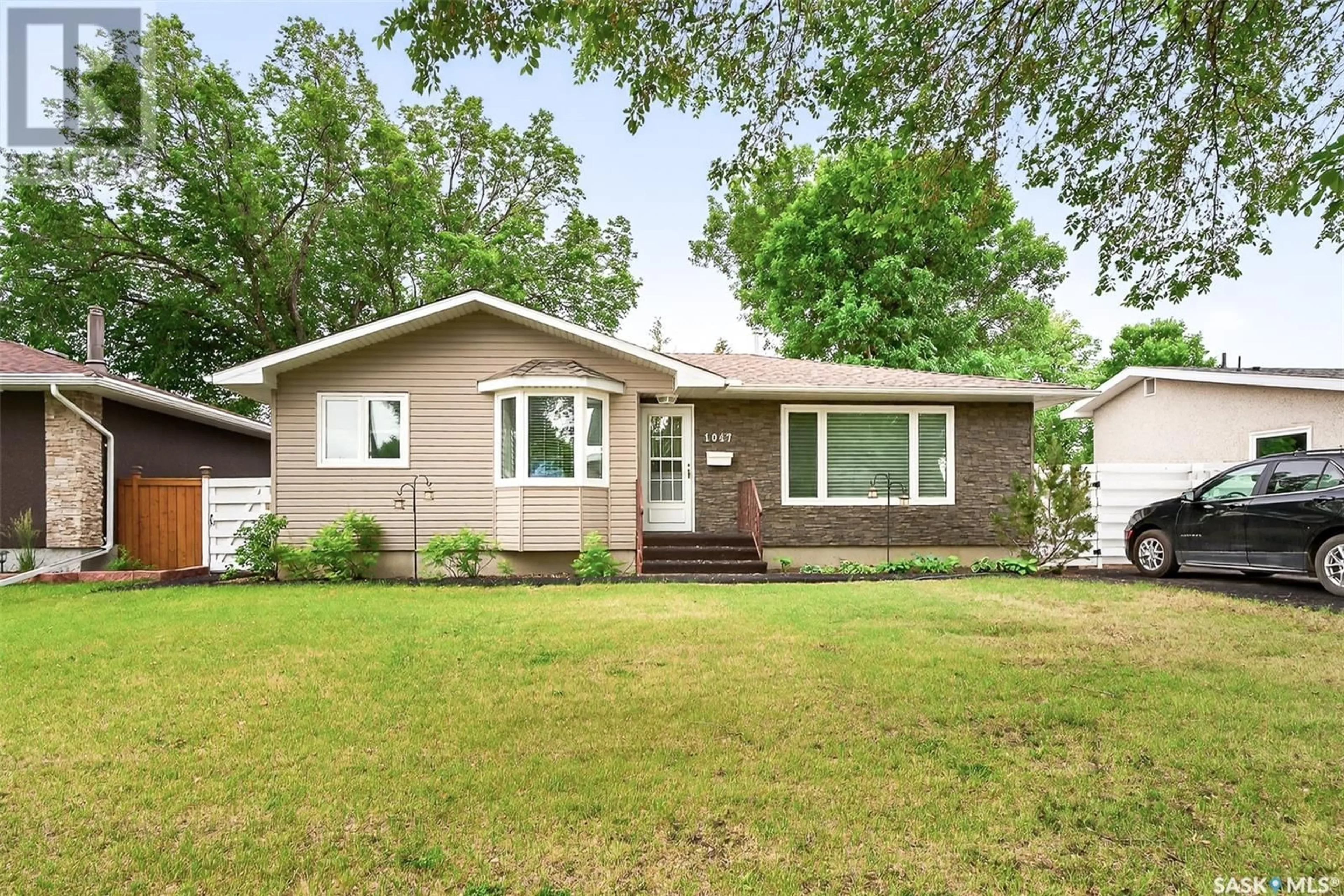 Home with vinyl exterior material, street for 1047 JAMES STREET, Moose Jaw Saskatchewan S6H3H8