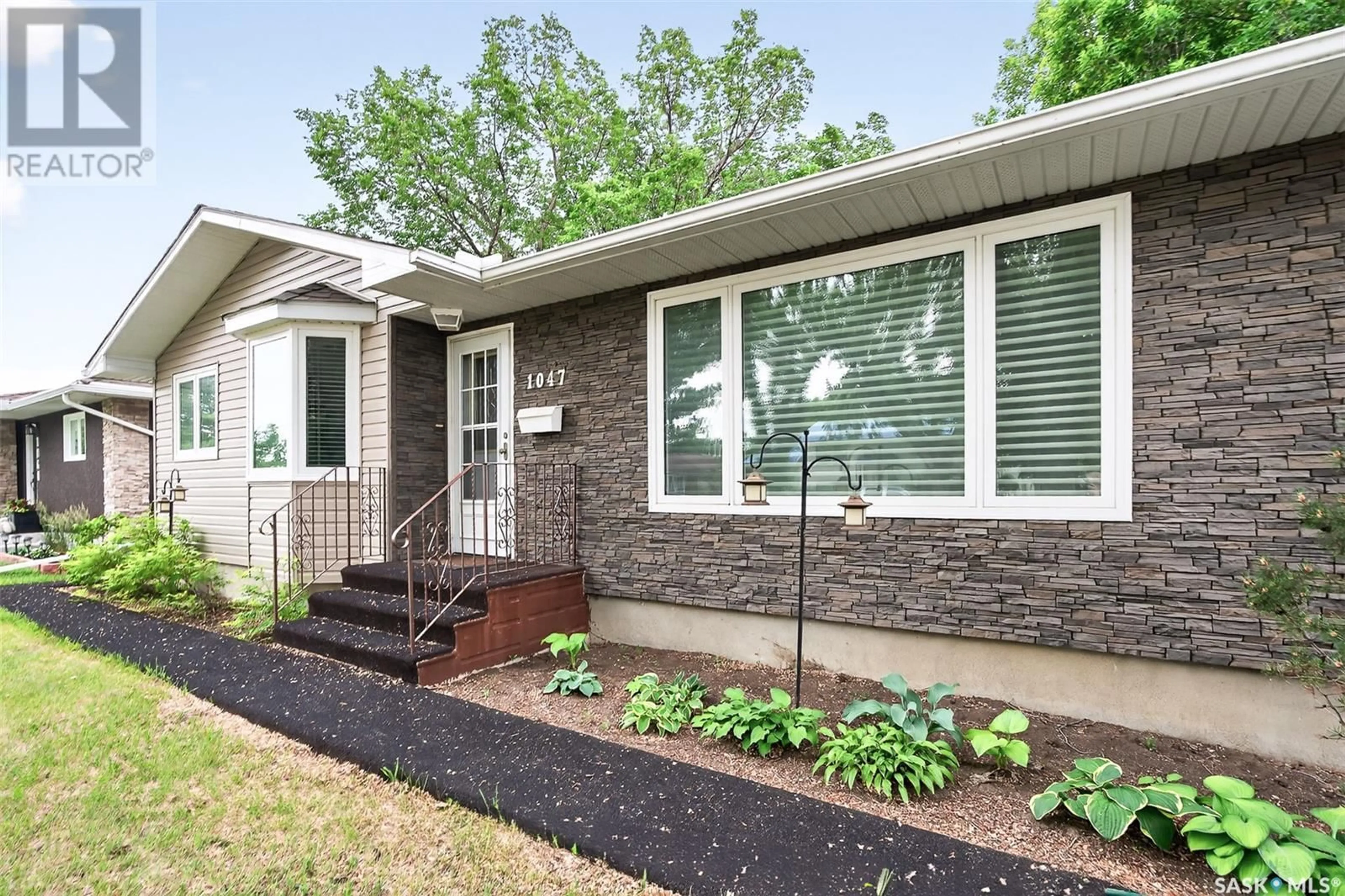 Home with brick exterior material, street for 1047 JAMES STREET, Moose Jaw Saskatchewan S6H3H8