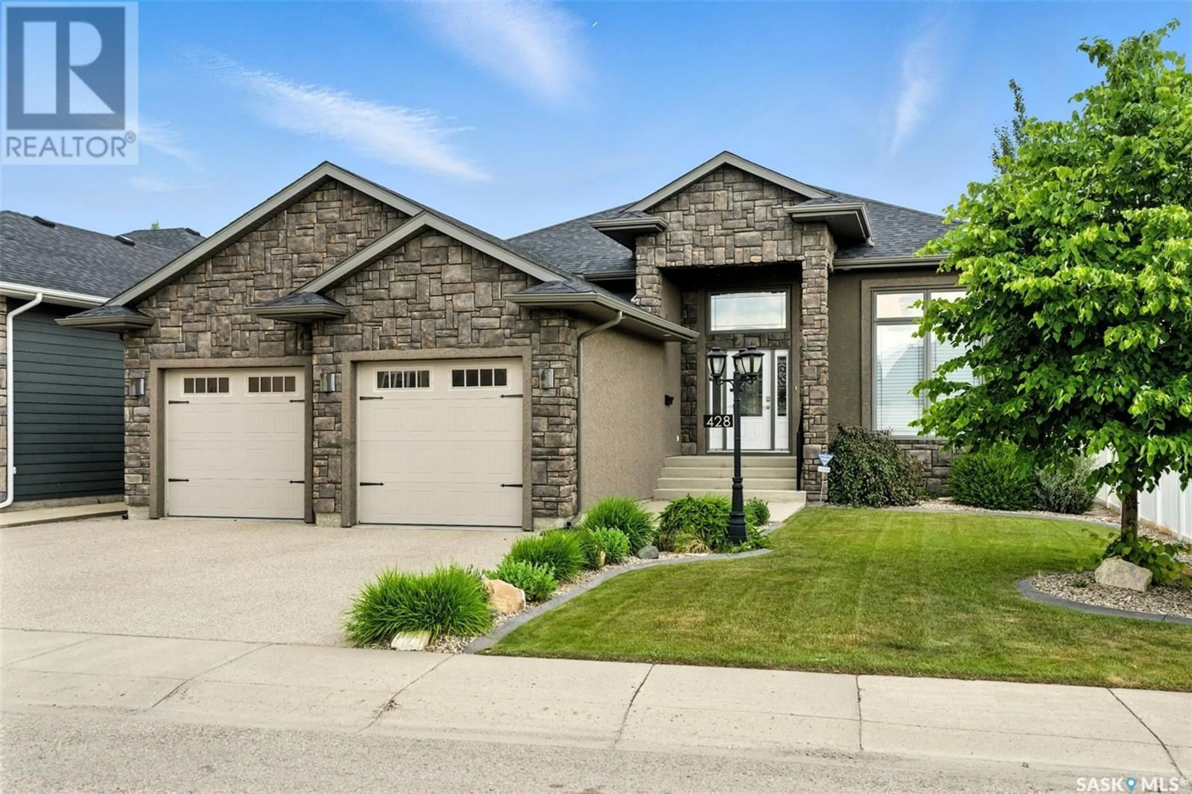 Home with brick exterior material, street for 428 FALDO CRESCENT, Warman Saskatchewan S0K4S1