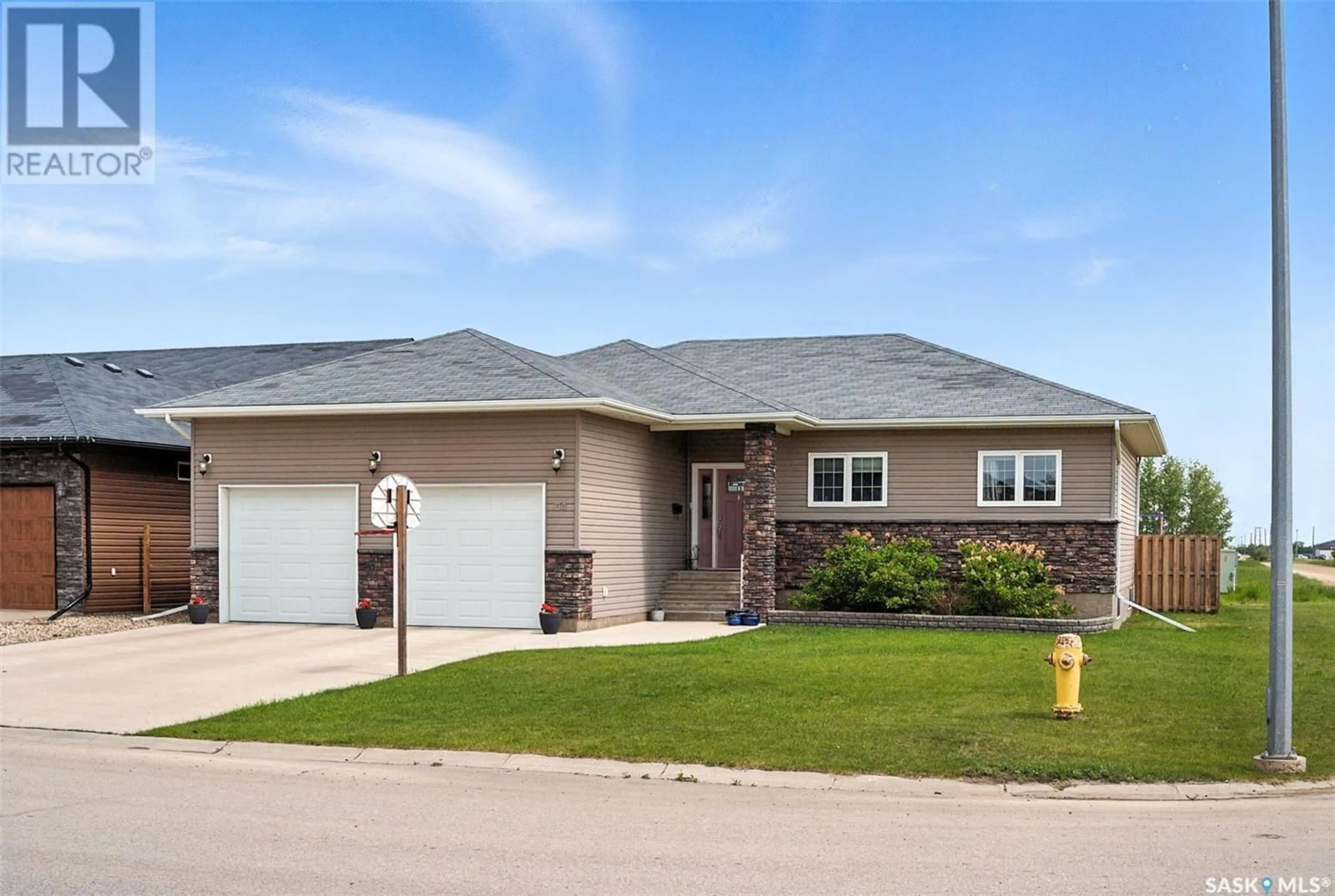 Home with vinyl exterior material, street for 84 14TH STREET, Humboldt Saskatchewan S0K2A0