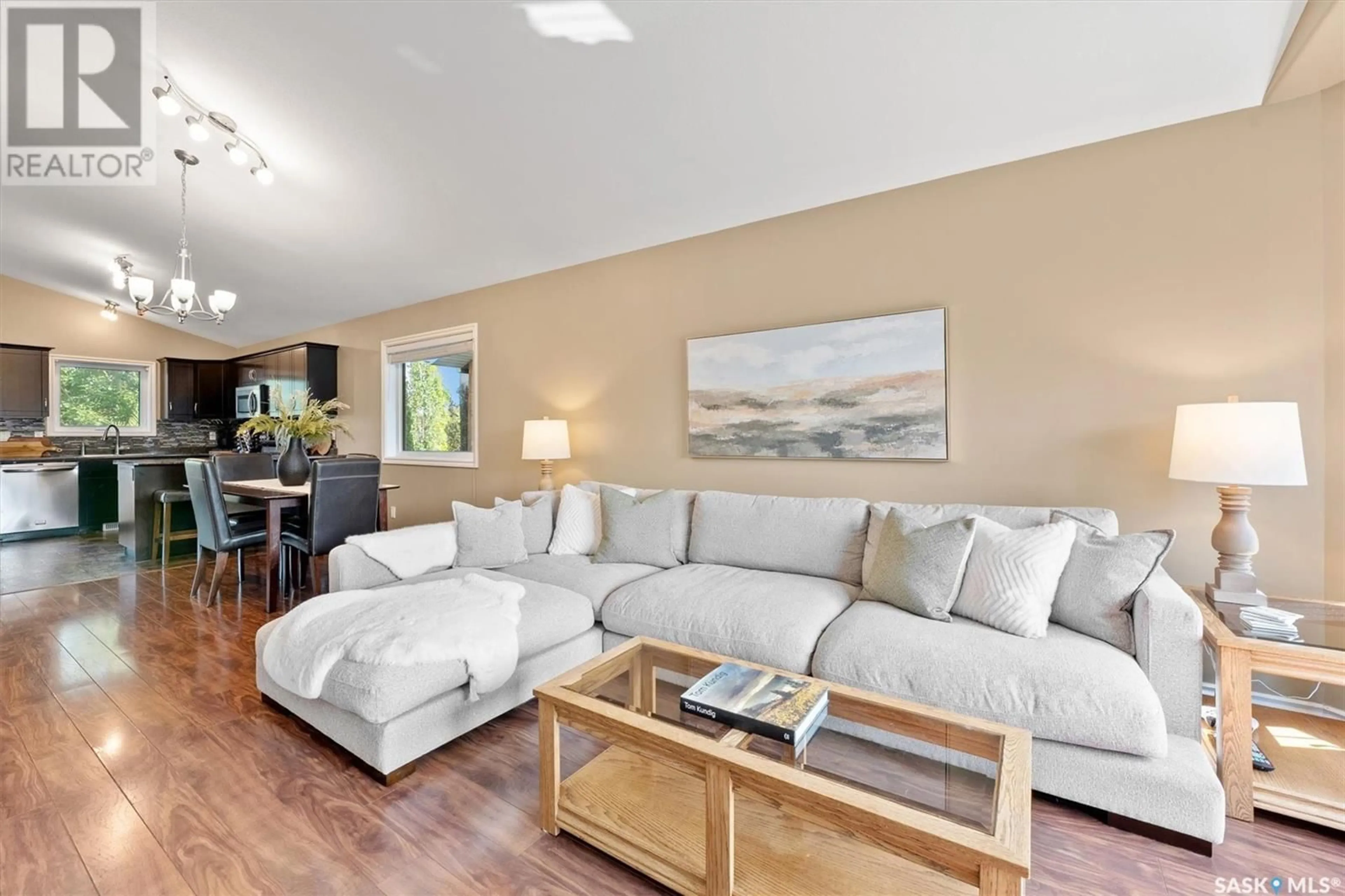 Living room with furniture, wood/laminate floor for 107 LUCYK CRESCENT, Saskatoon Saskatchewan S7W0E9