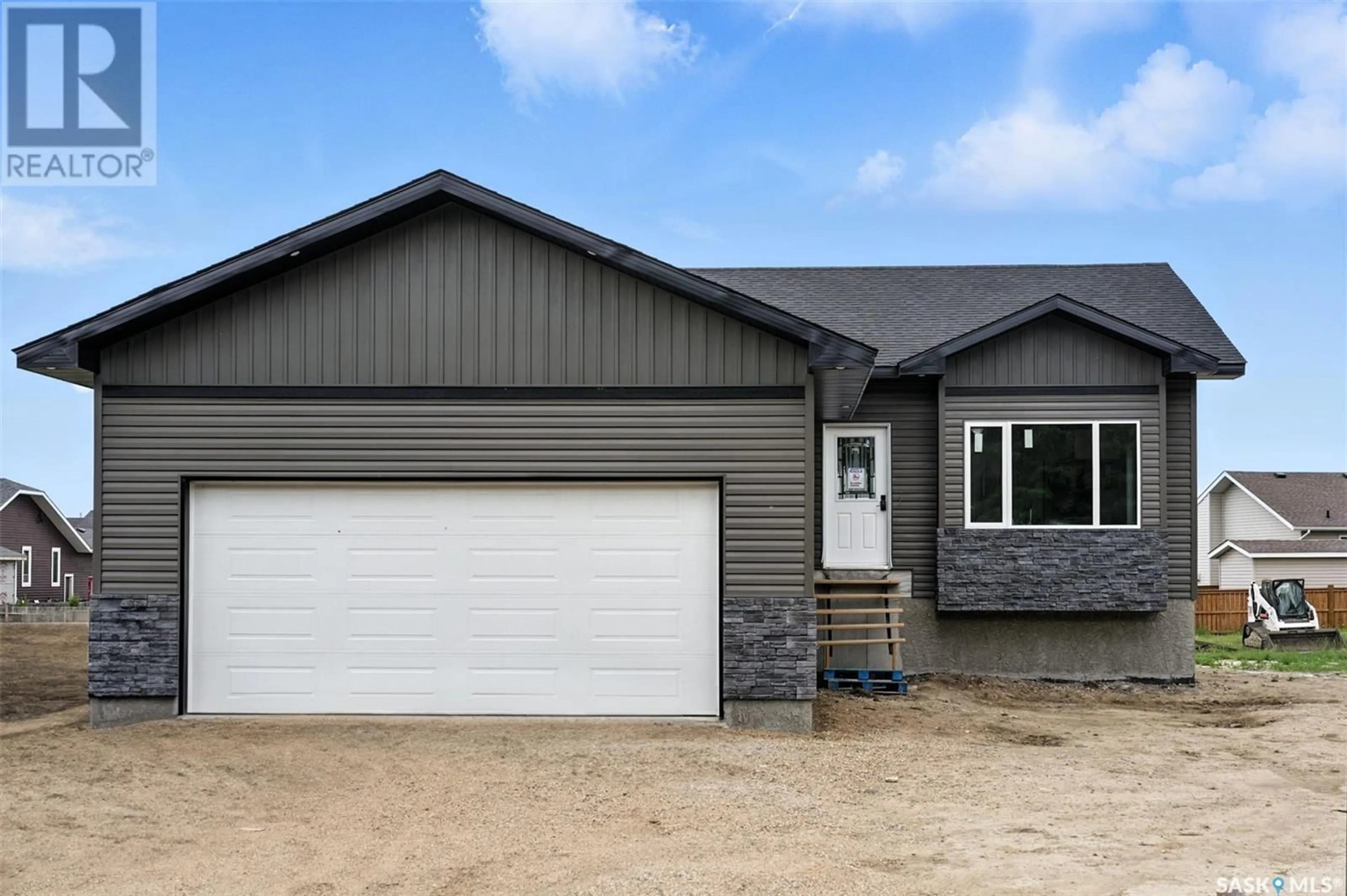 Home with vinyl exterior material, street for 208 2ND STREET, Waldheim Saskatchewan S0K4R0