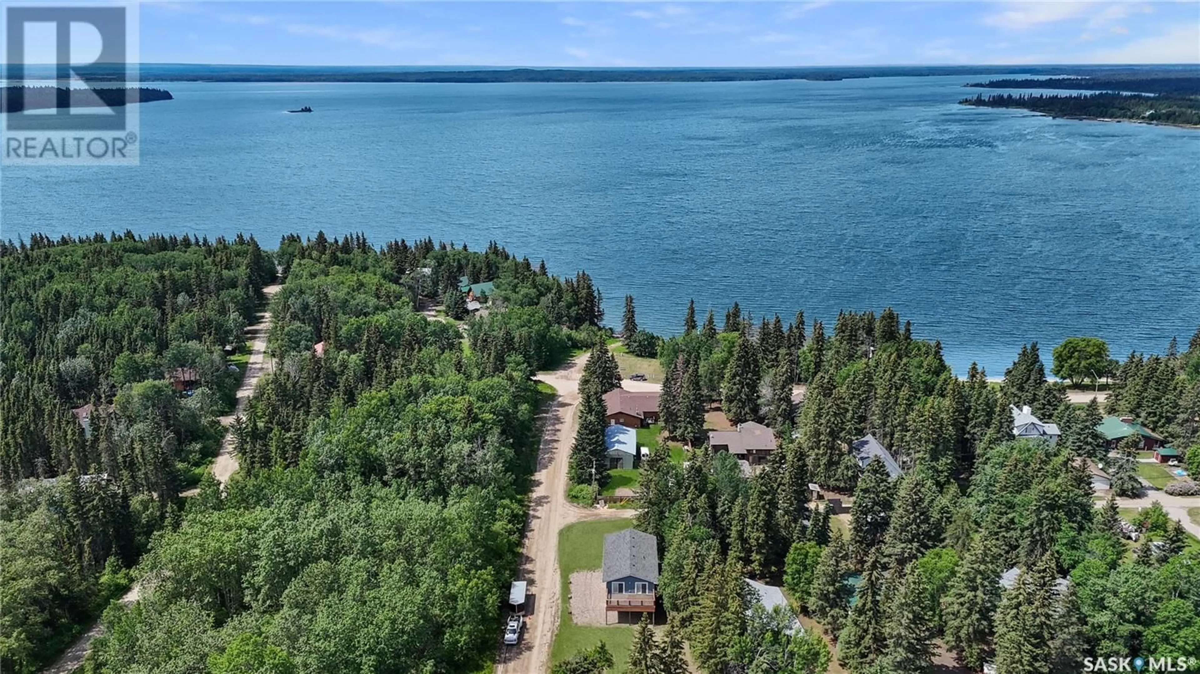 A pic from outside/outdoor area/front of a property/back of a property/a pic from drone, water/lake/river/ocean view for 720 RAILWAY STREET, Chitek Lake Saskatchewan S0J0L0