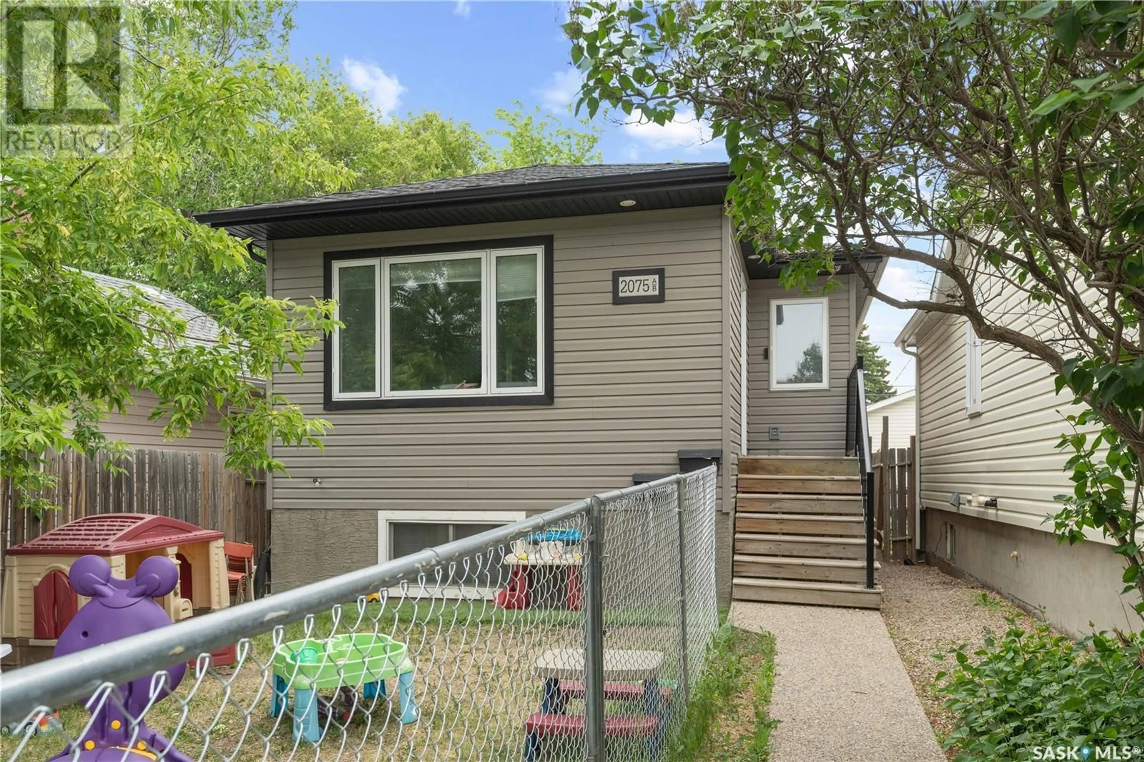 Home with vinyl exterior material, street for 2075 LINDSAY STREET, Regina Saskatchewan S4N3B8