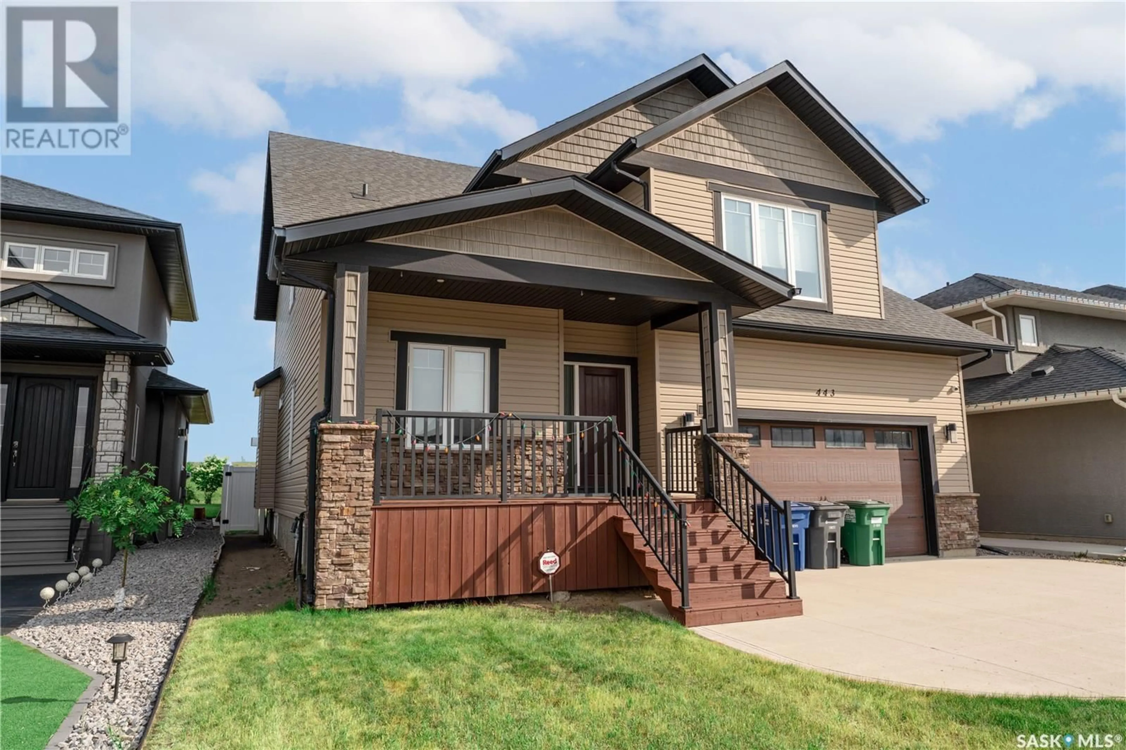 Home with vinyl exterior material, street for 443 MAHABIR CRESCENT, Saskatoon Saskatchewan S7W0J7